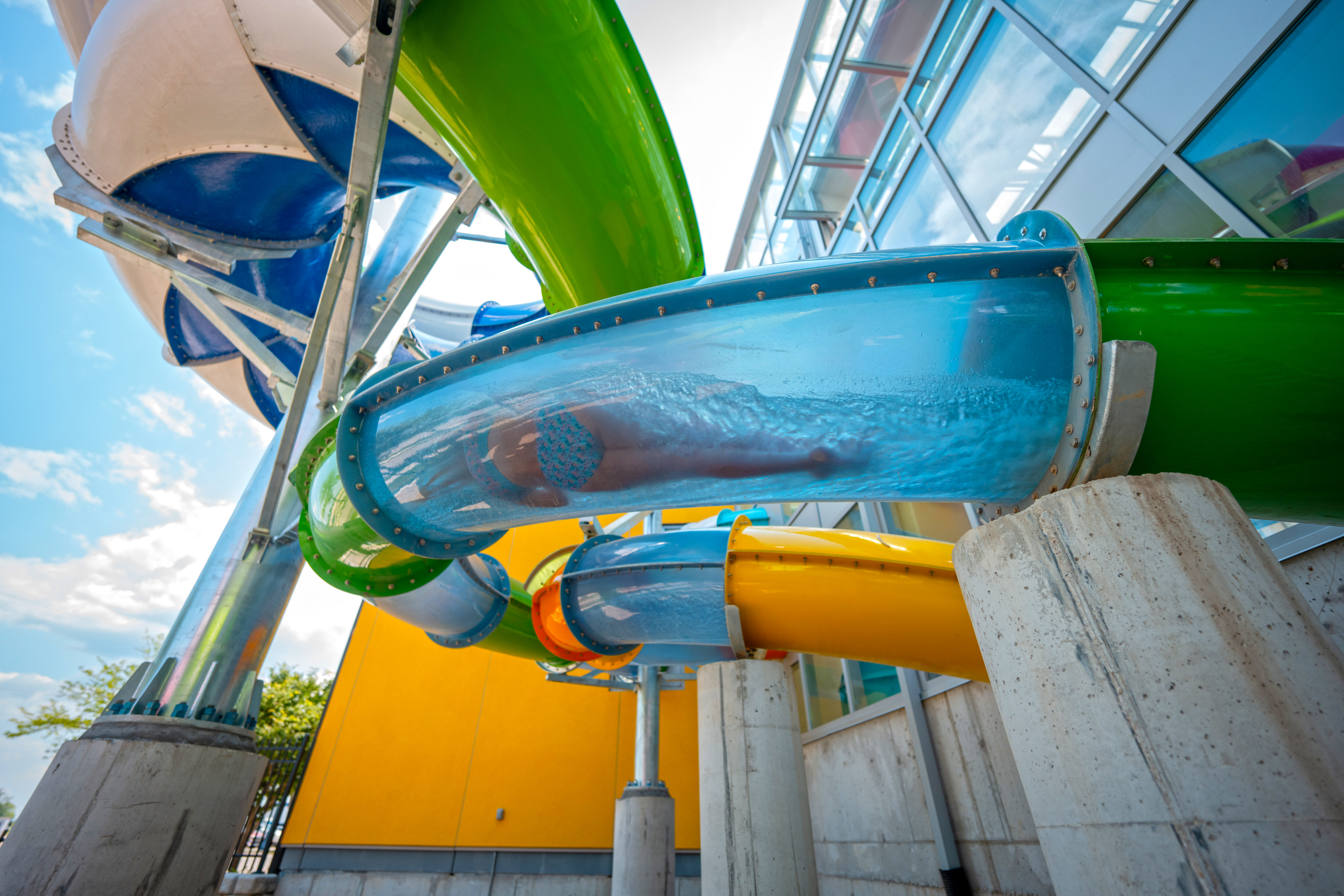 A body sliding through a water slide flume