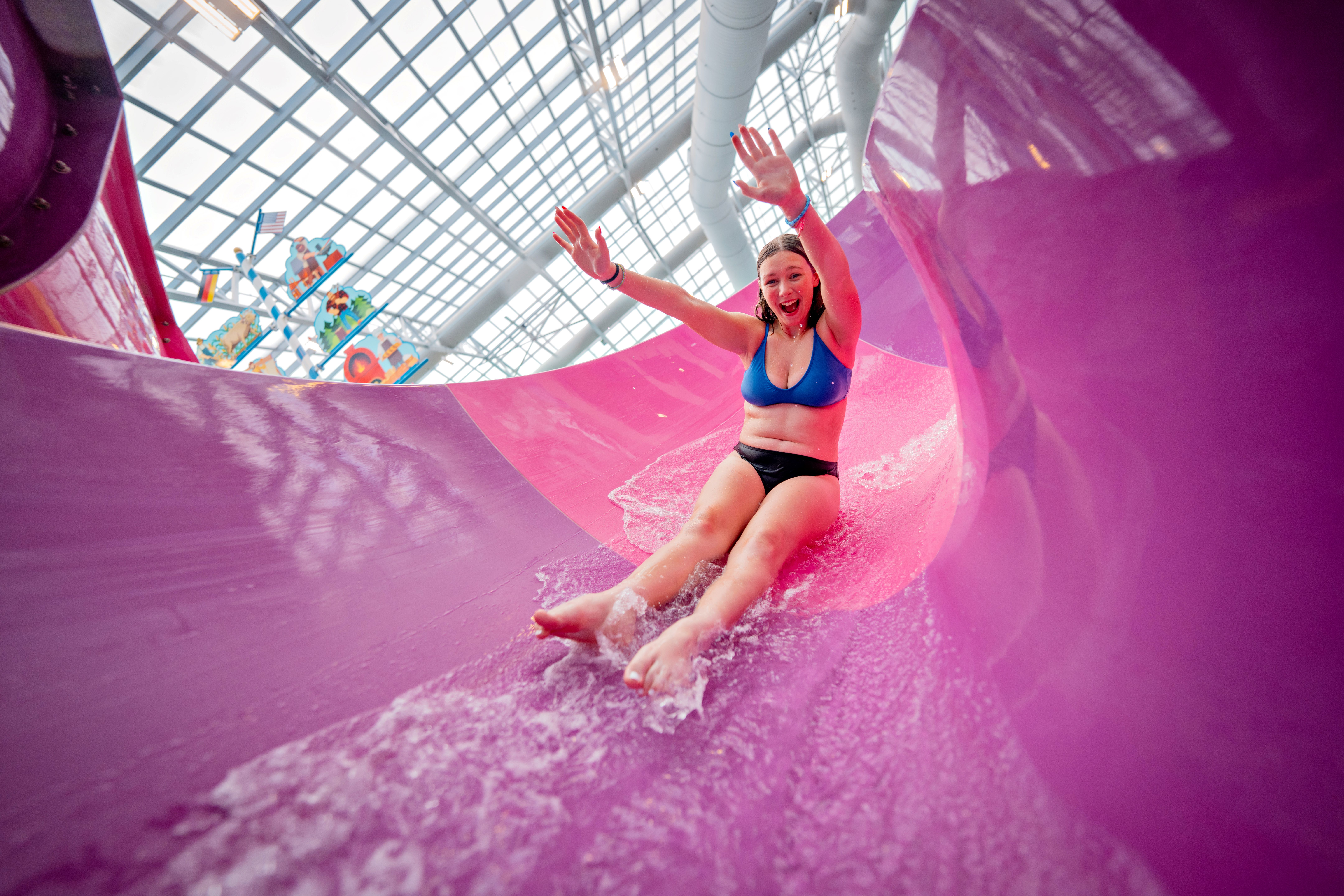 Woman in an open flume water slide