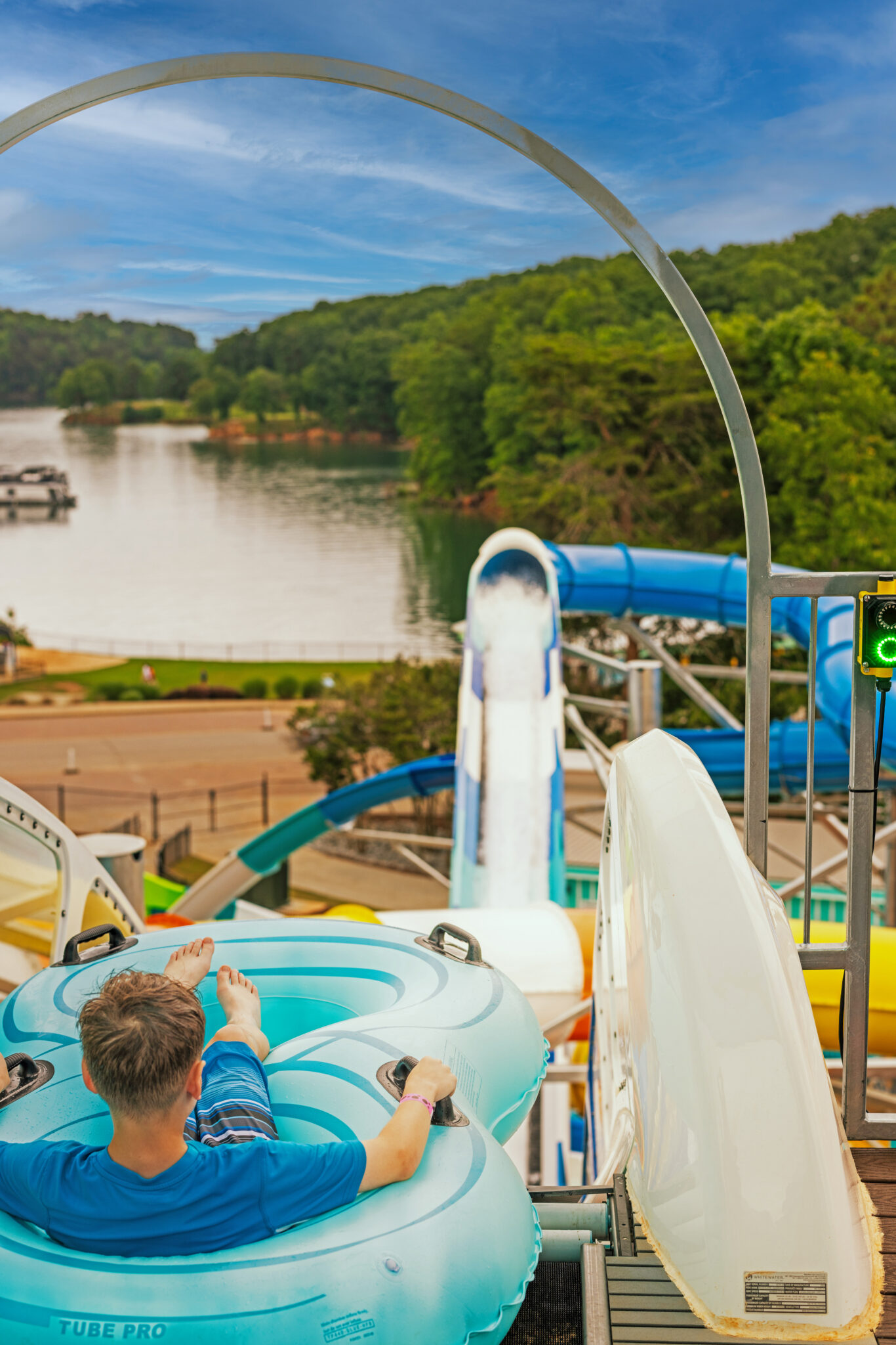 Man in an inner tube at the top of a water coaster