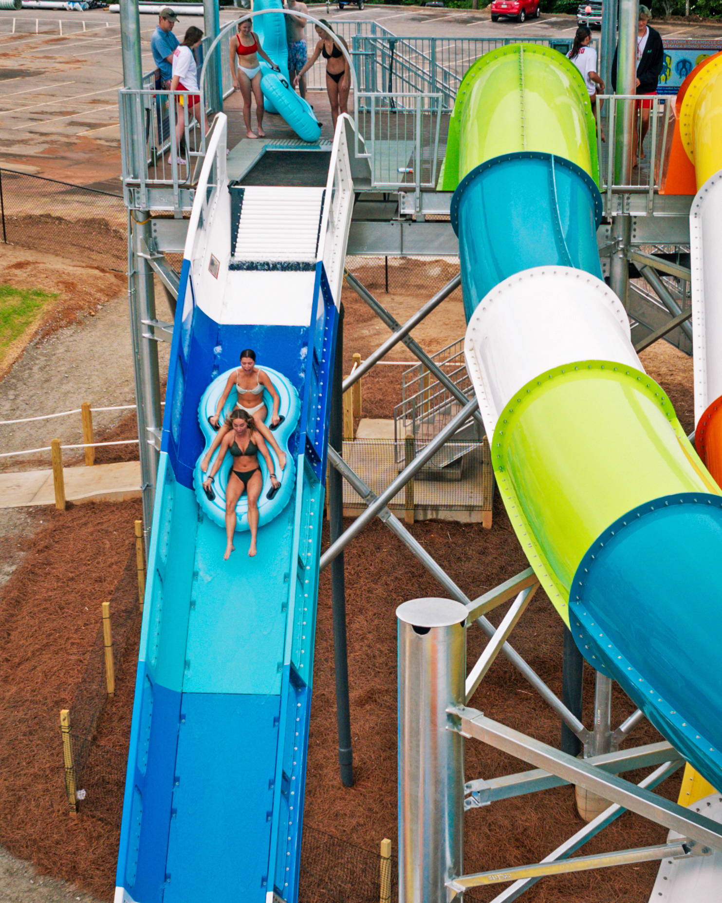 Riders in an inner tube going down a water coaster