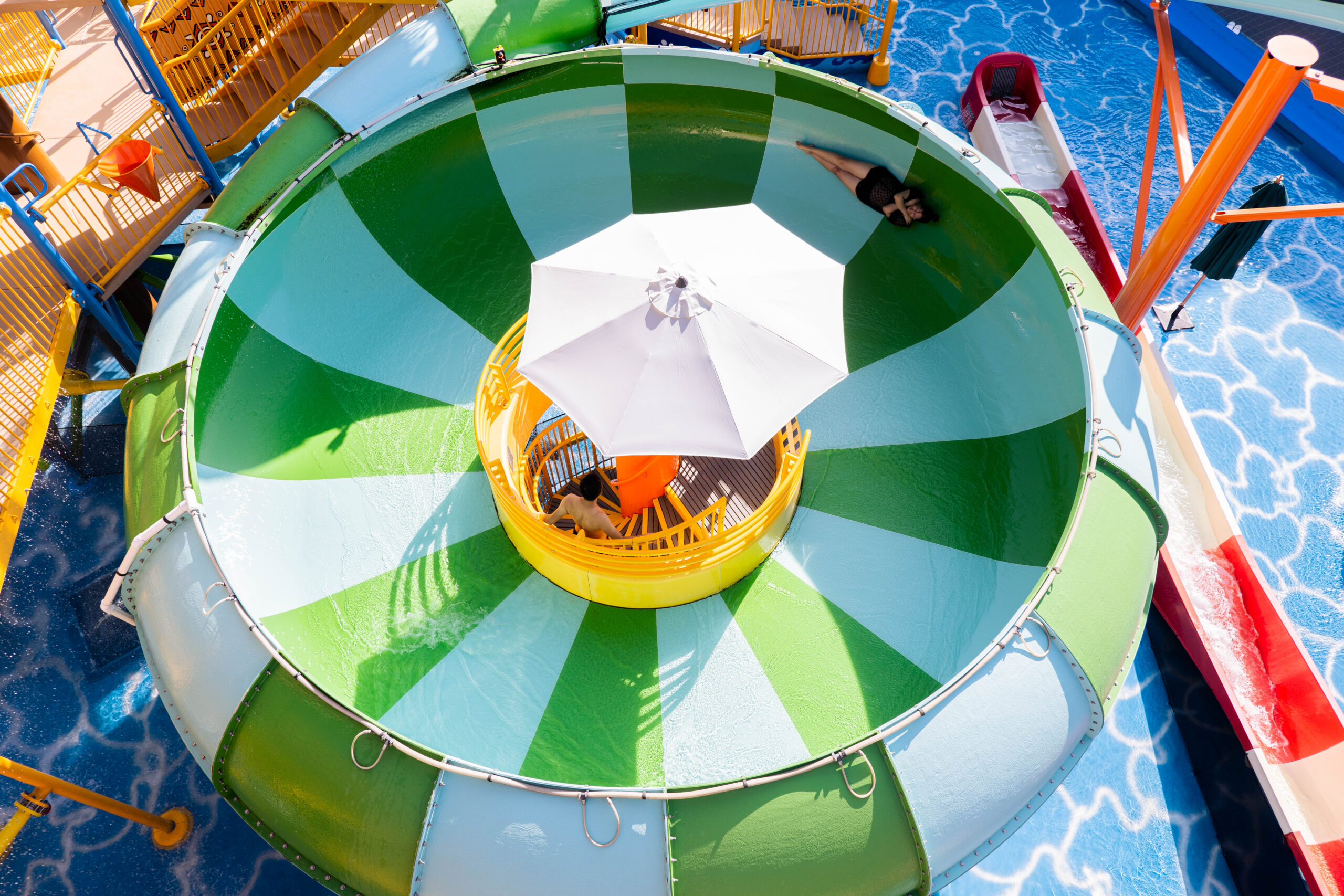A woman inside a water slide bowl