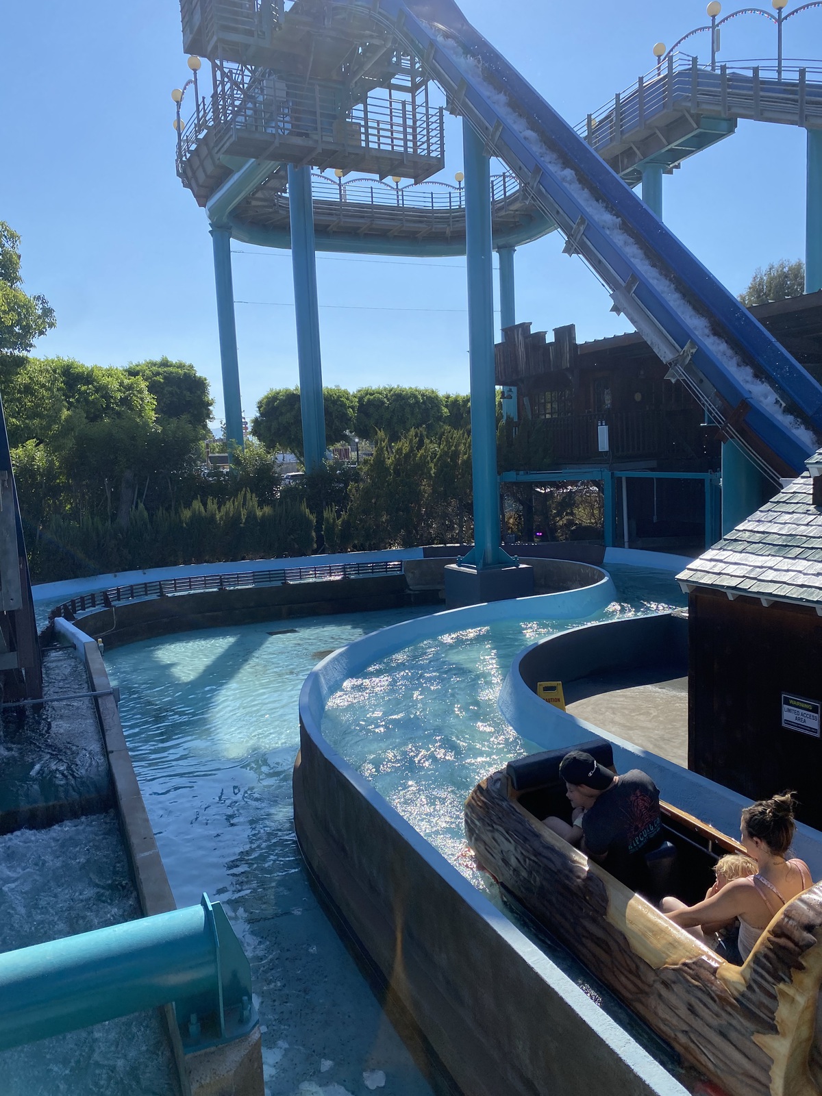 A log flume ride and track under blue skies