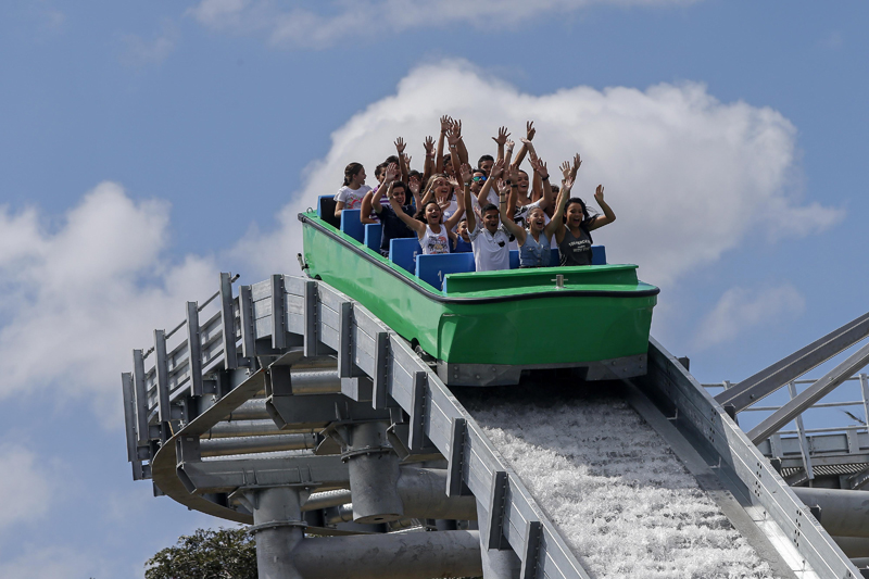 Riders in a Shoot the Chute ride