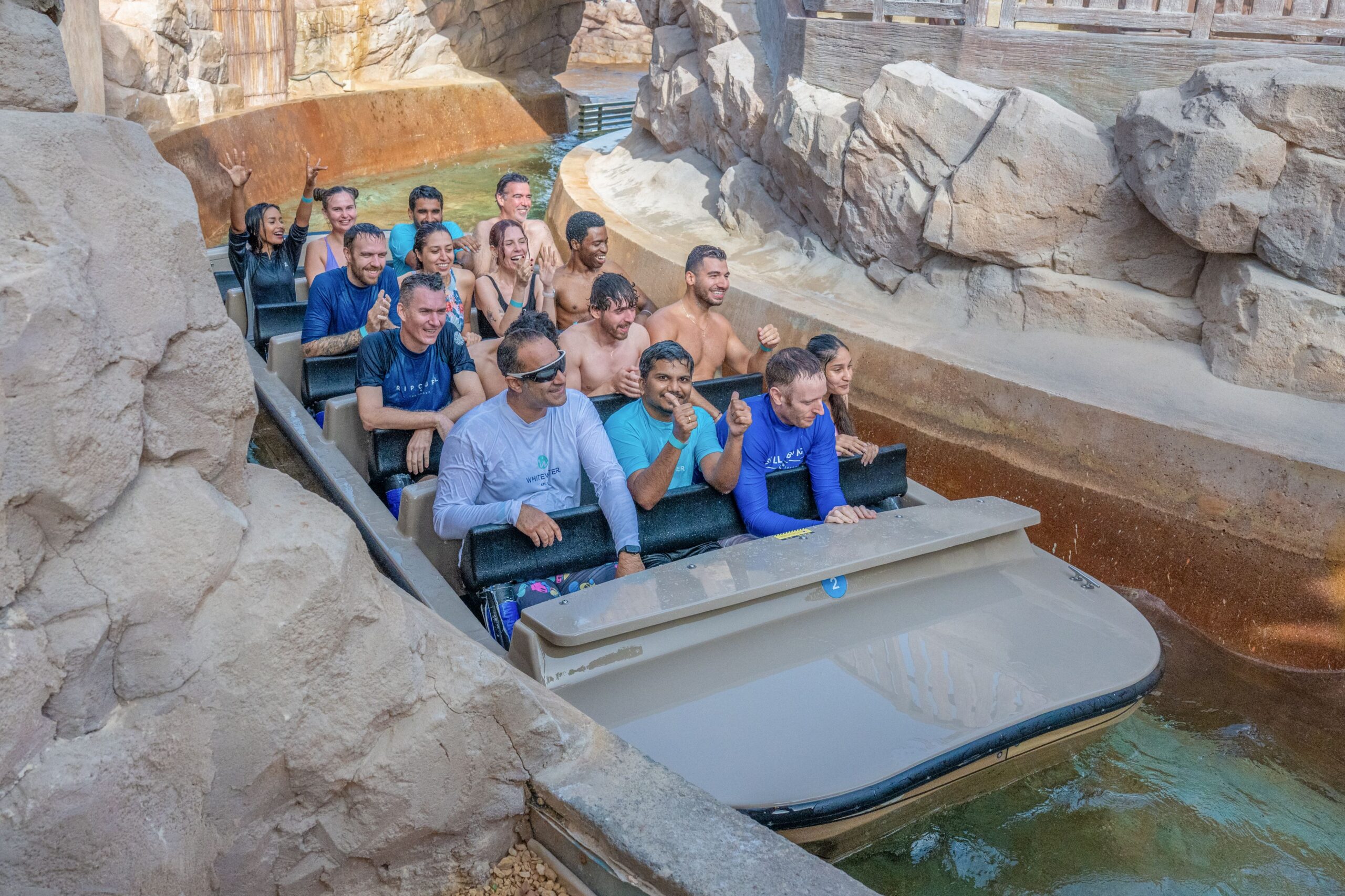 Riders wet in a Shoot the Chute boat