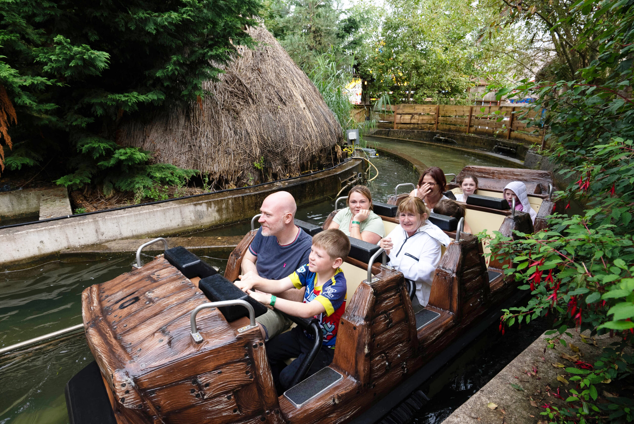 Riders in a Super Flume vehicle mid-ride