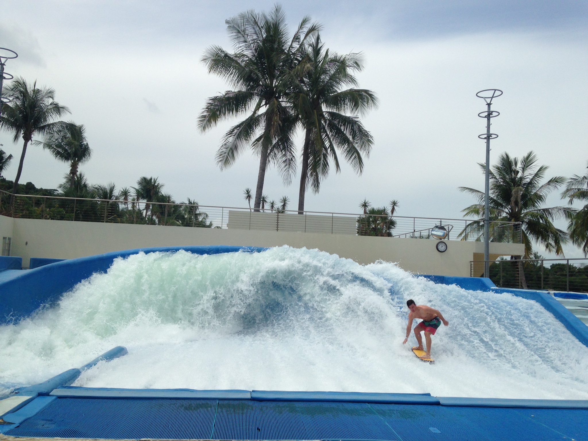 A man tries to get higher waves on a flowrider