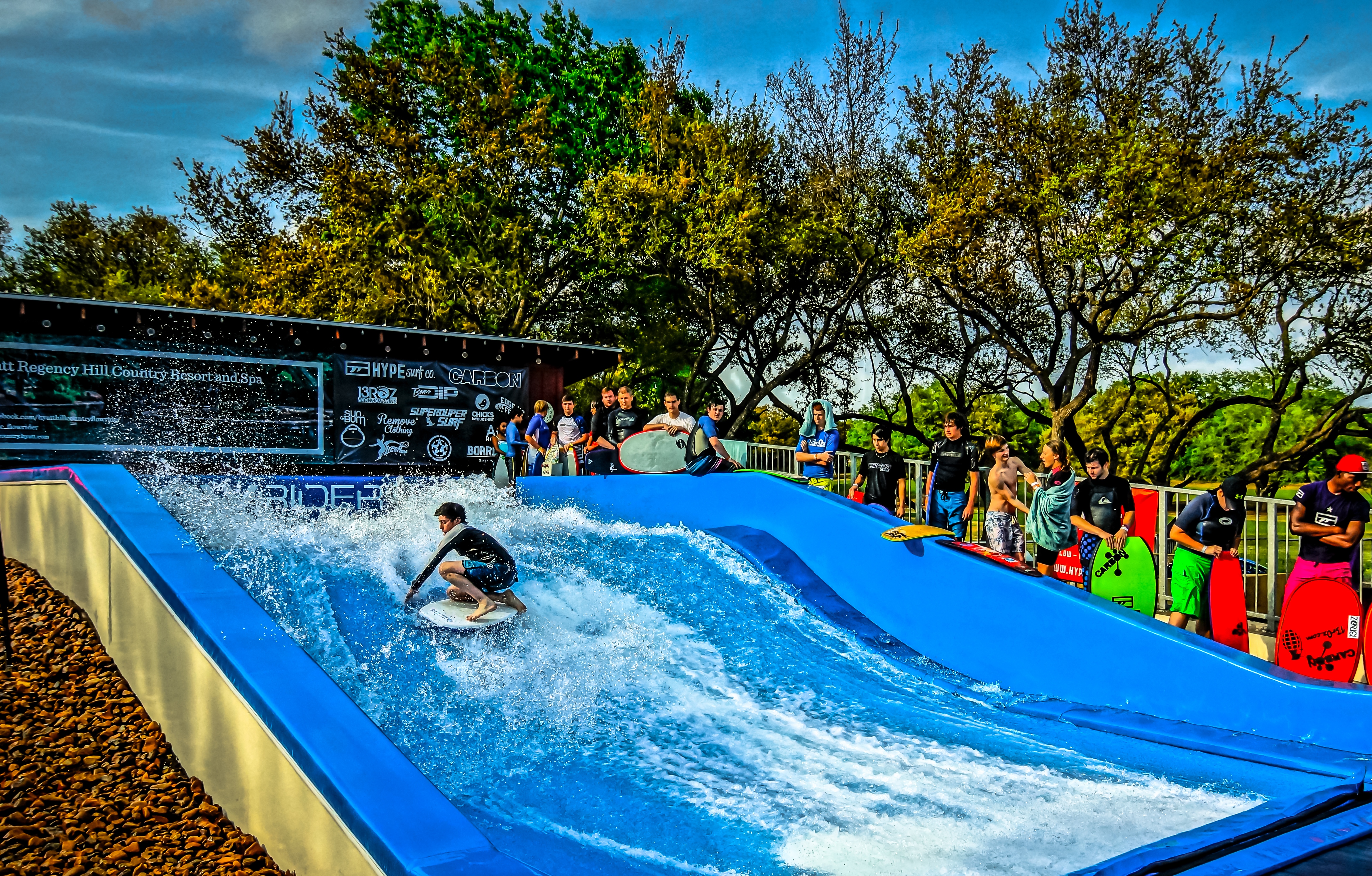 Outside view of a Flowboarder surfing a FlowRider Single