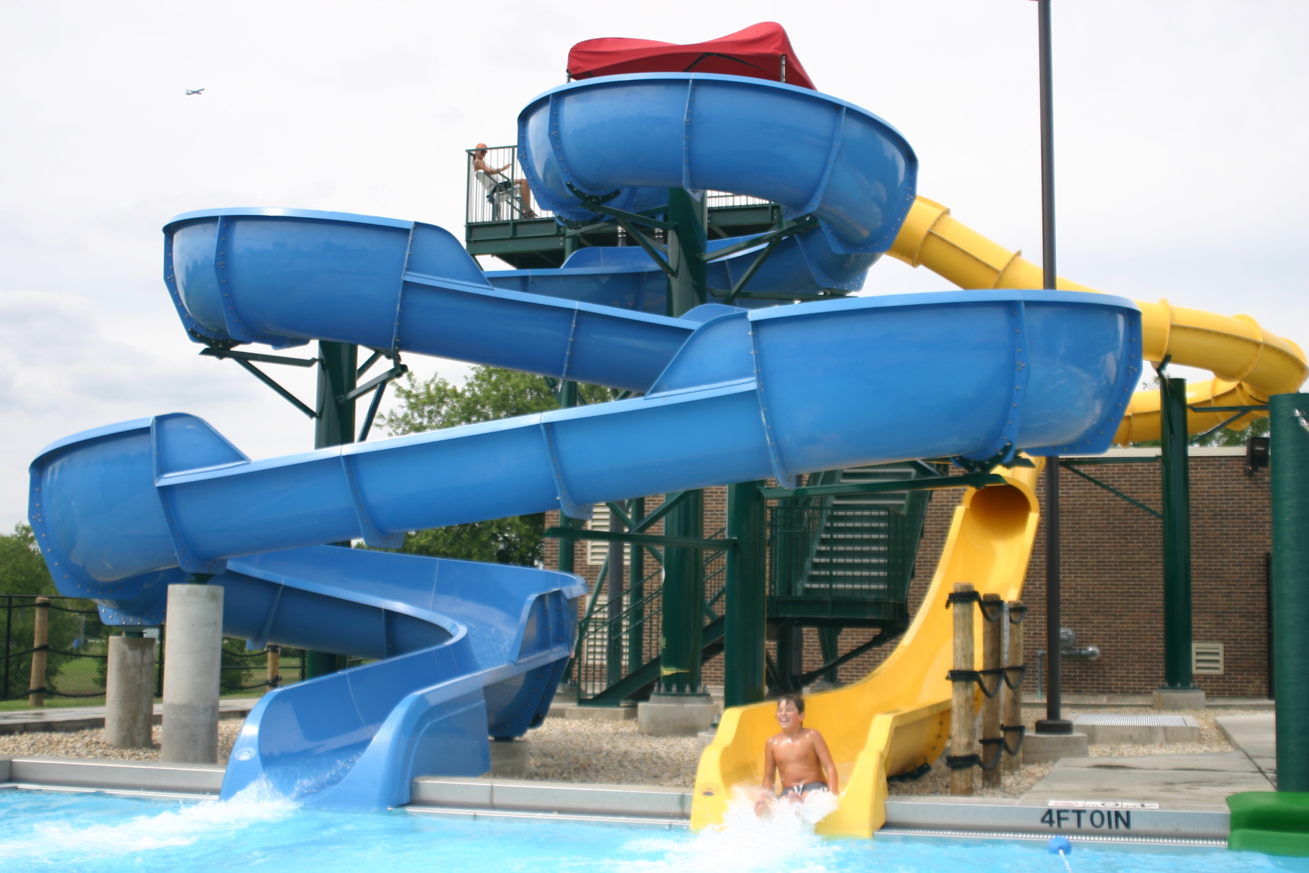 Two mini blue and yellow slides for children