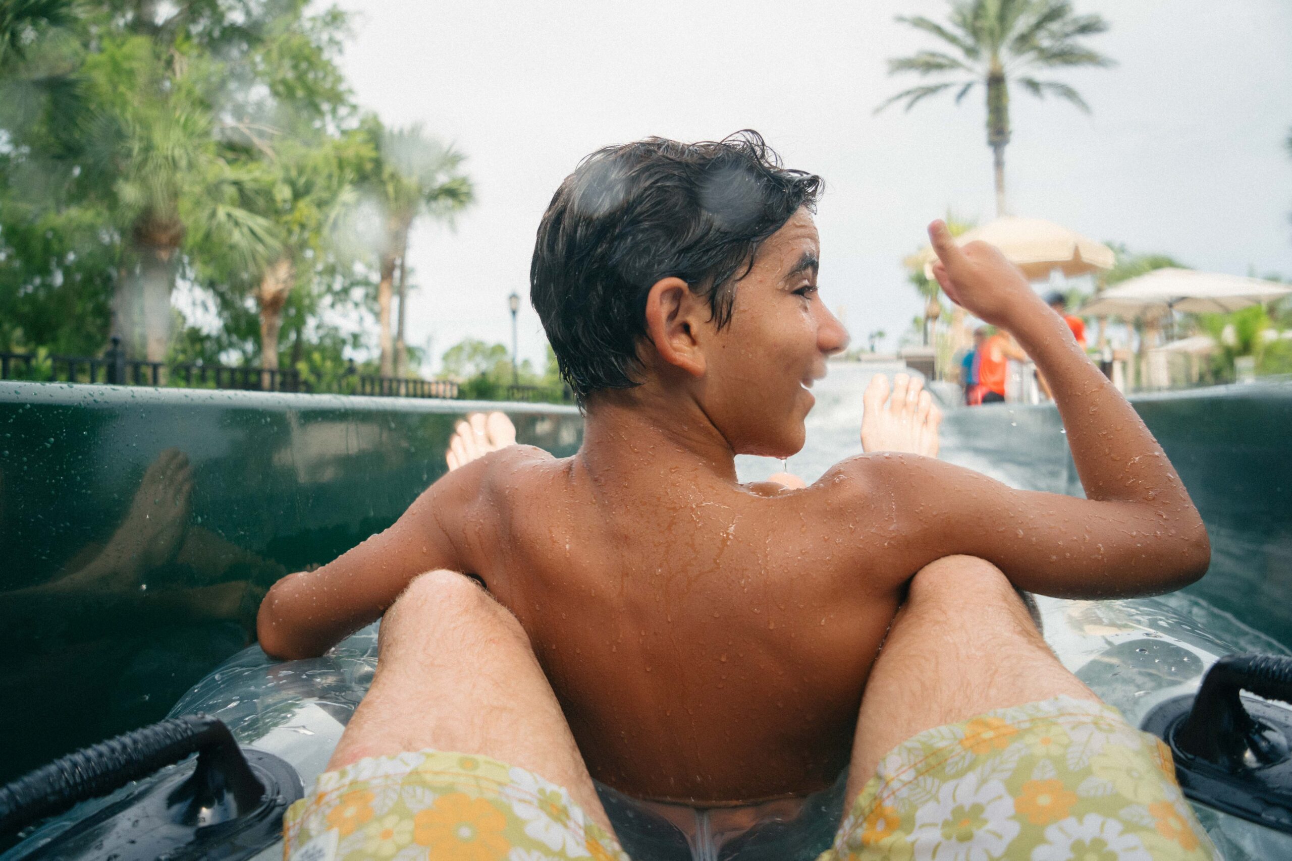 Boy on an inner tube in a water slide