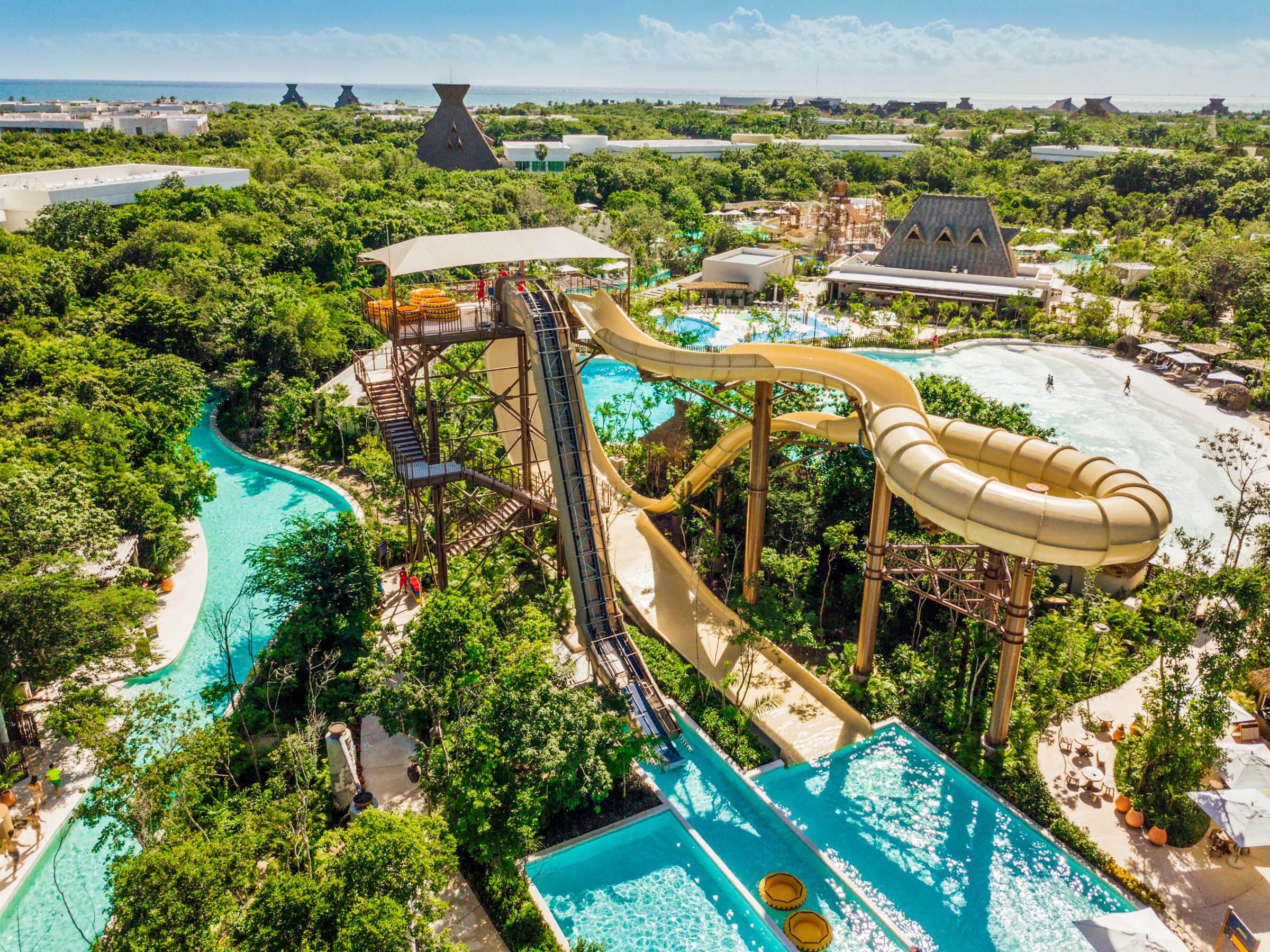 water slide tower in lush green