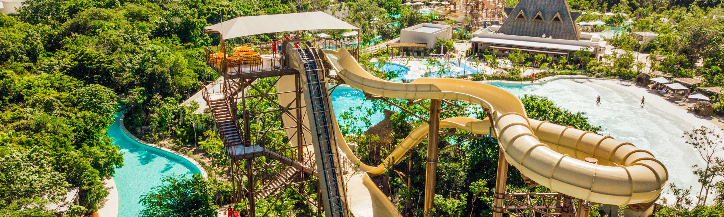 water slide tower in lush gree