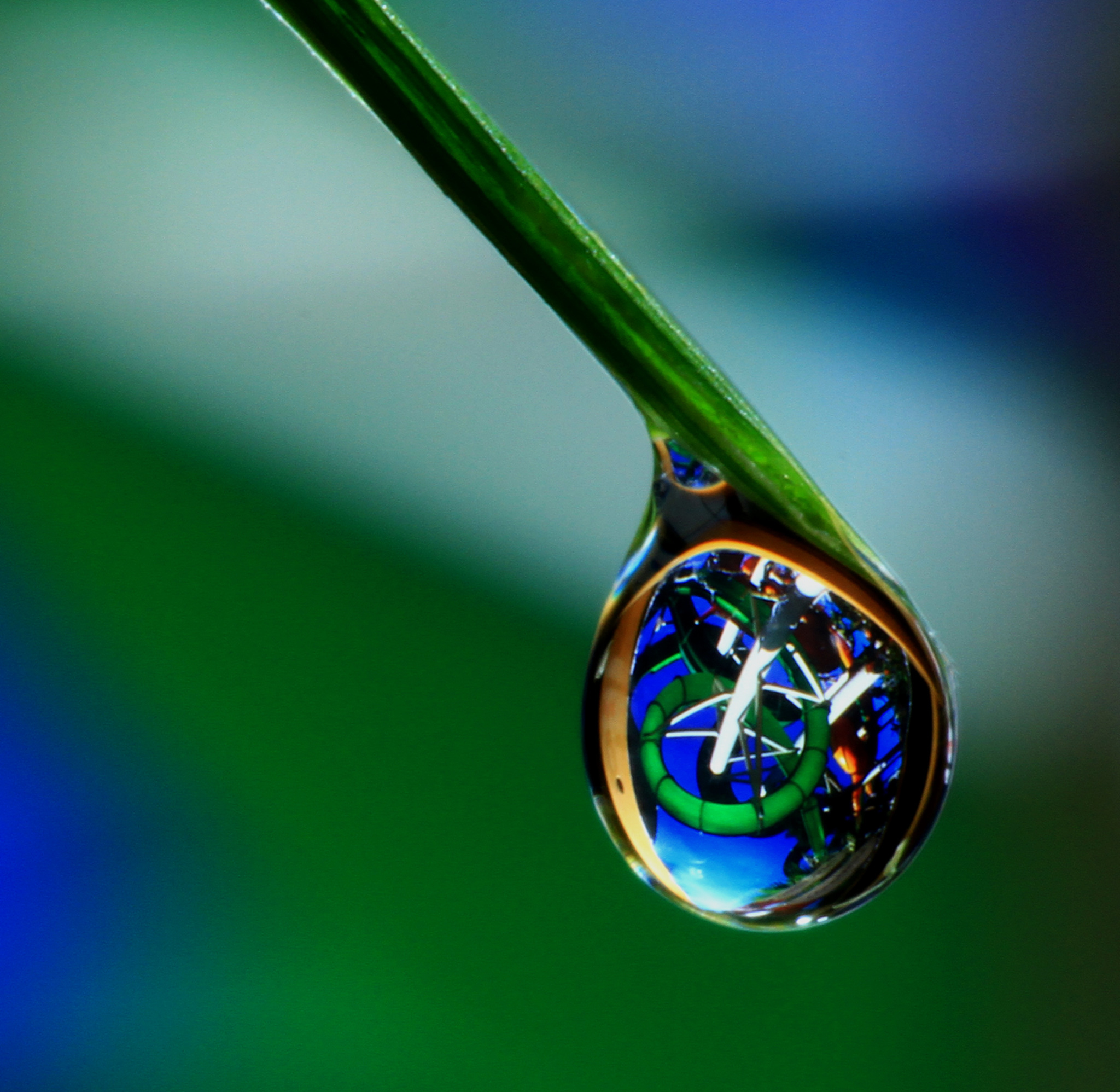 Water slide reflected off water drop