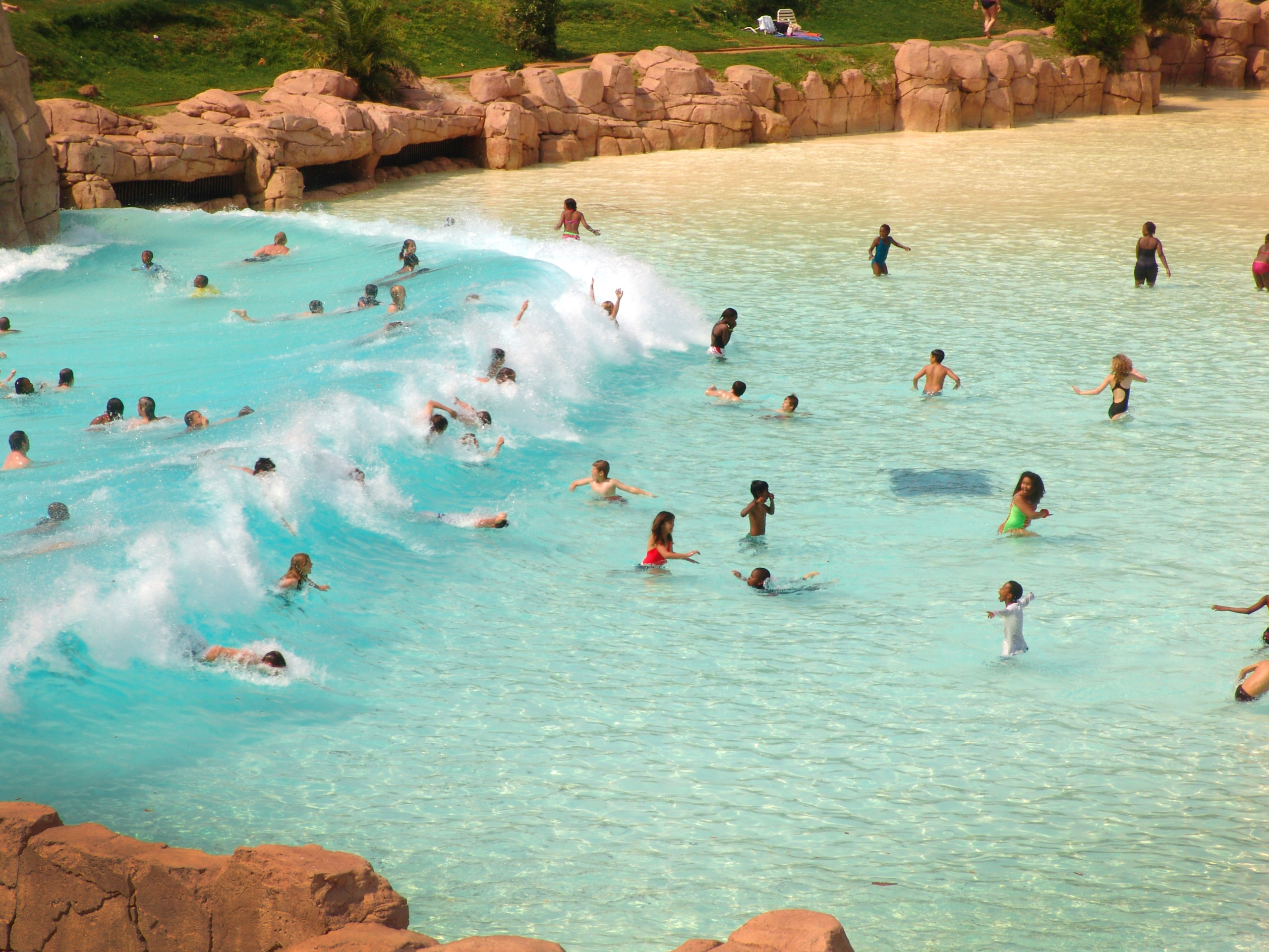 People enjoying big wave pool