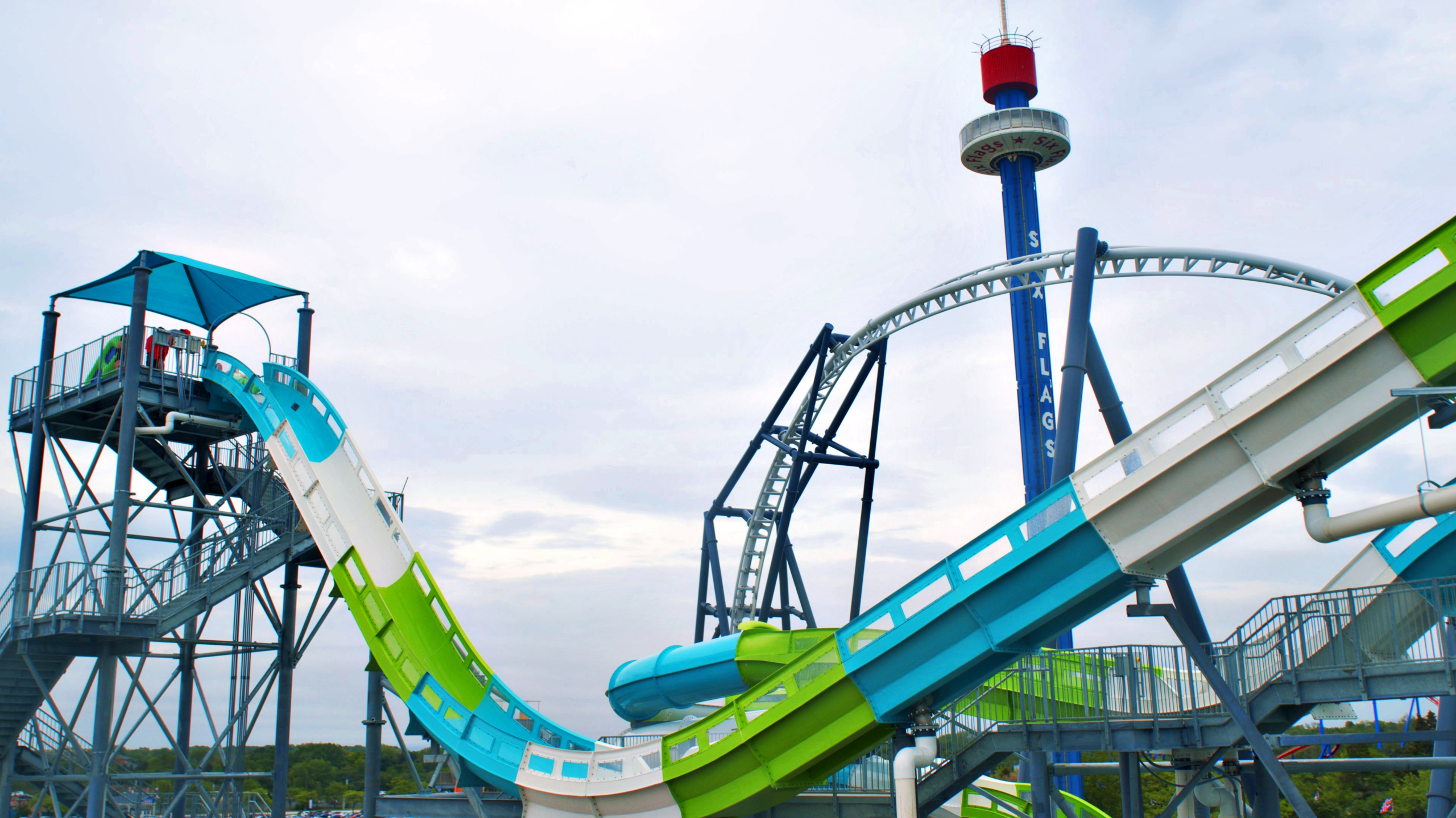 Blue green Tsunami Surge water coaster at Six Flags Hurricane Harbor