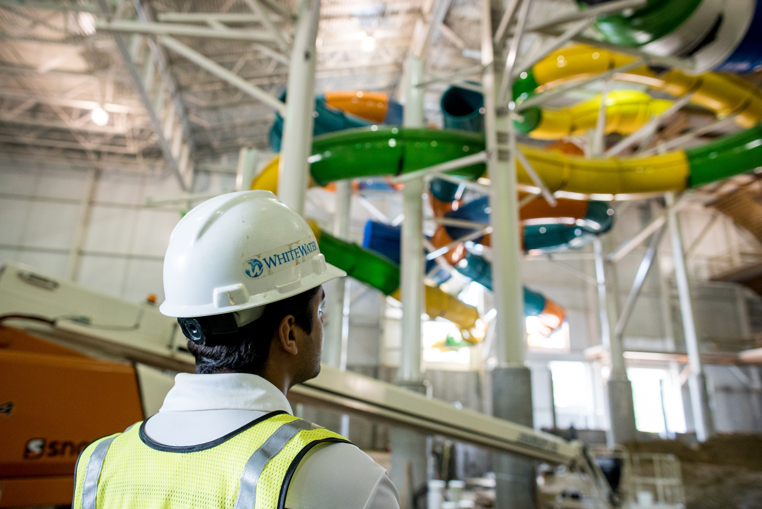 Engineer installing water slide