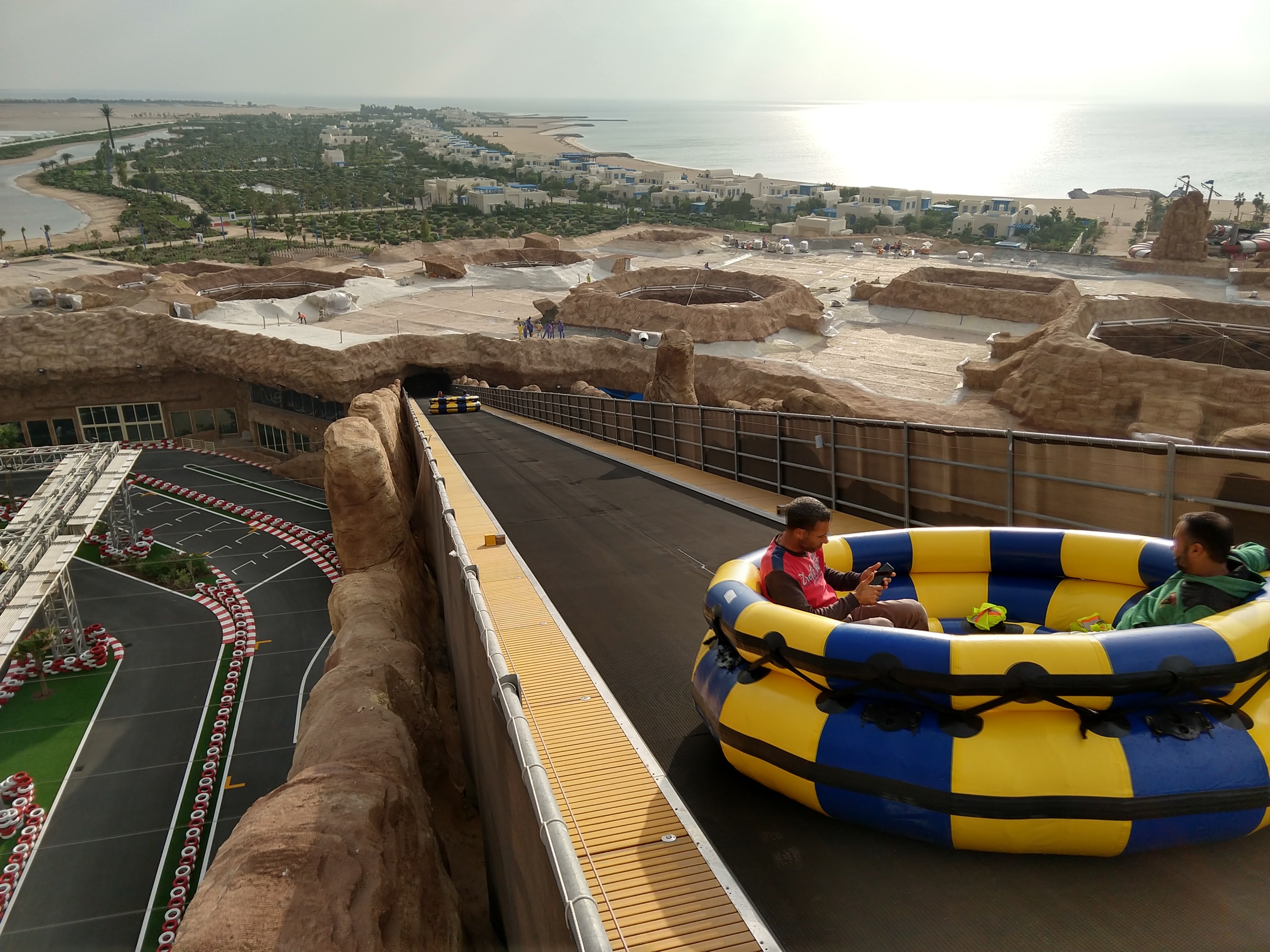 A Spinning Rapids Ride raft going up a conveyor