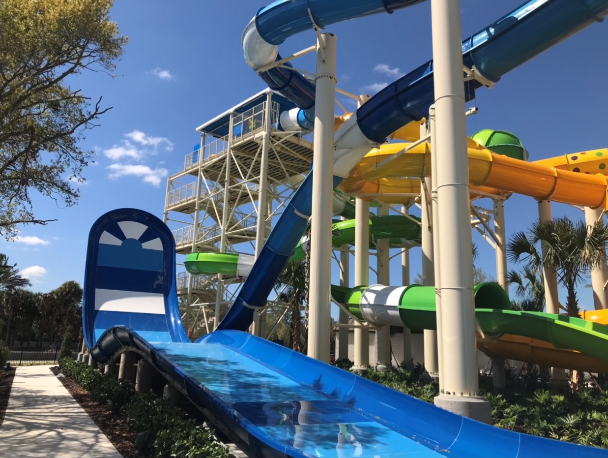 Water slide tower with yellow, green, blue water slides