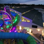 SlideWheel lit up at night with colours