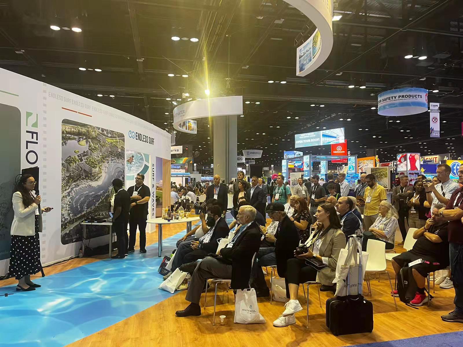 Audience around a press conference about water parks and attractions