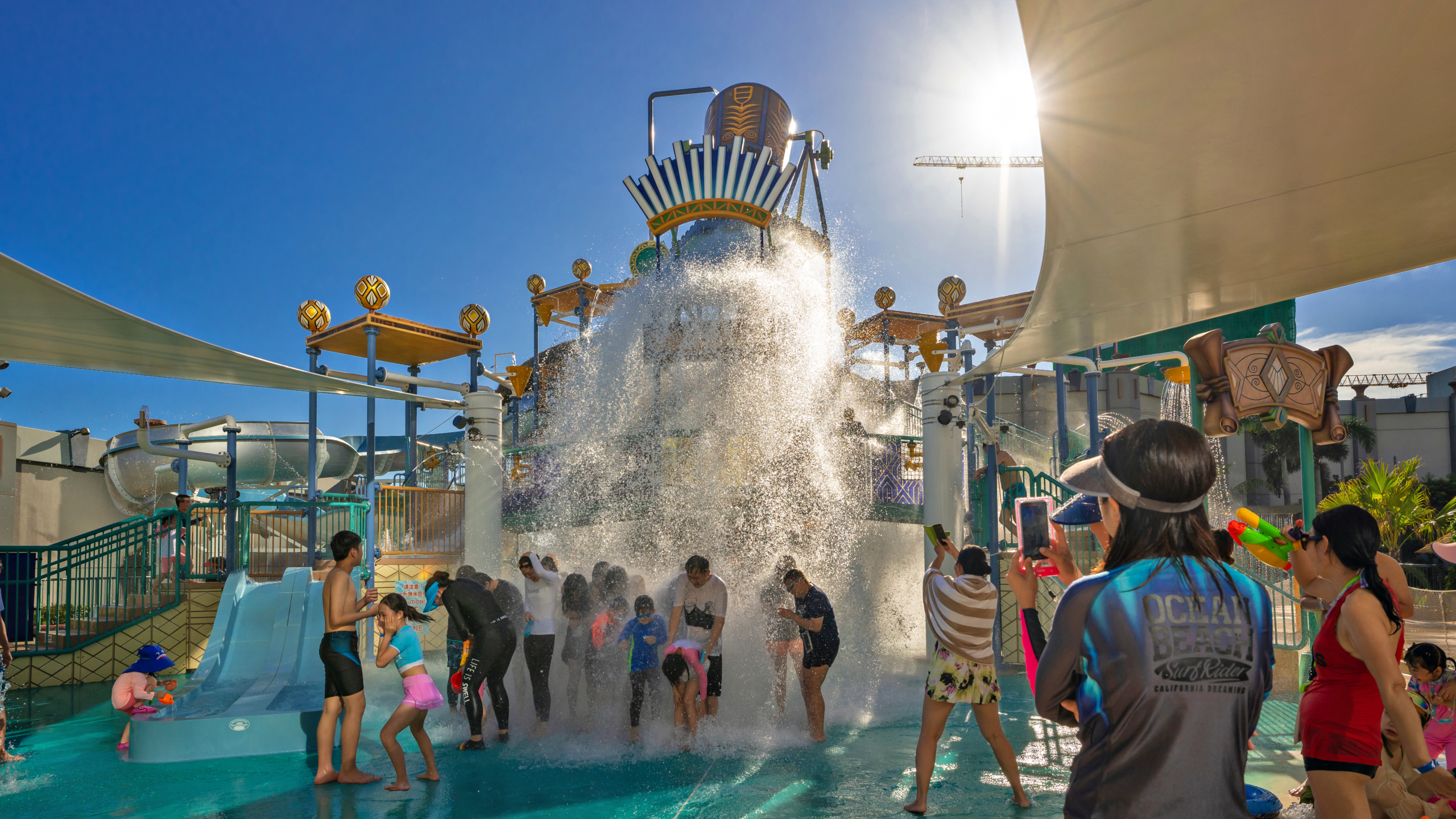 aquatic play structure with tipping bucket spilling water