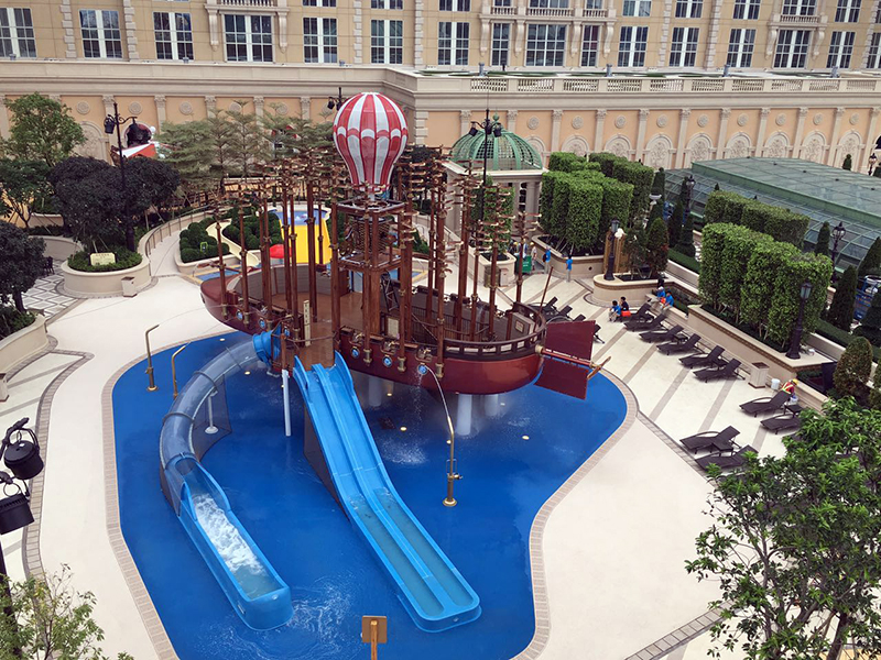 Aquatic play structure with futuristic boat theming