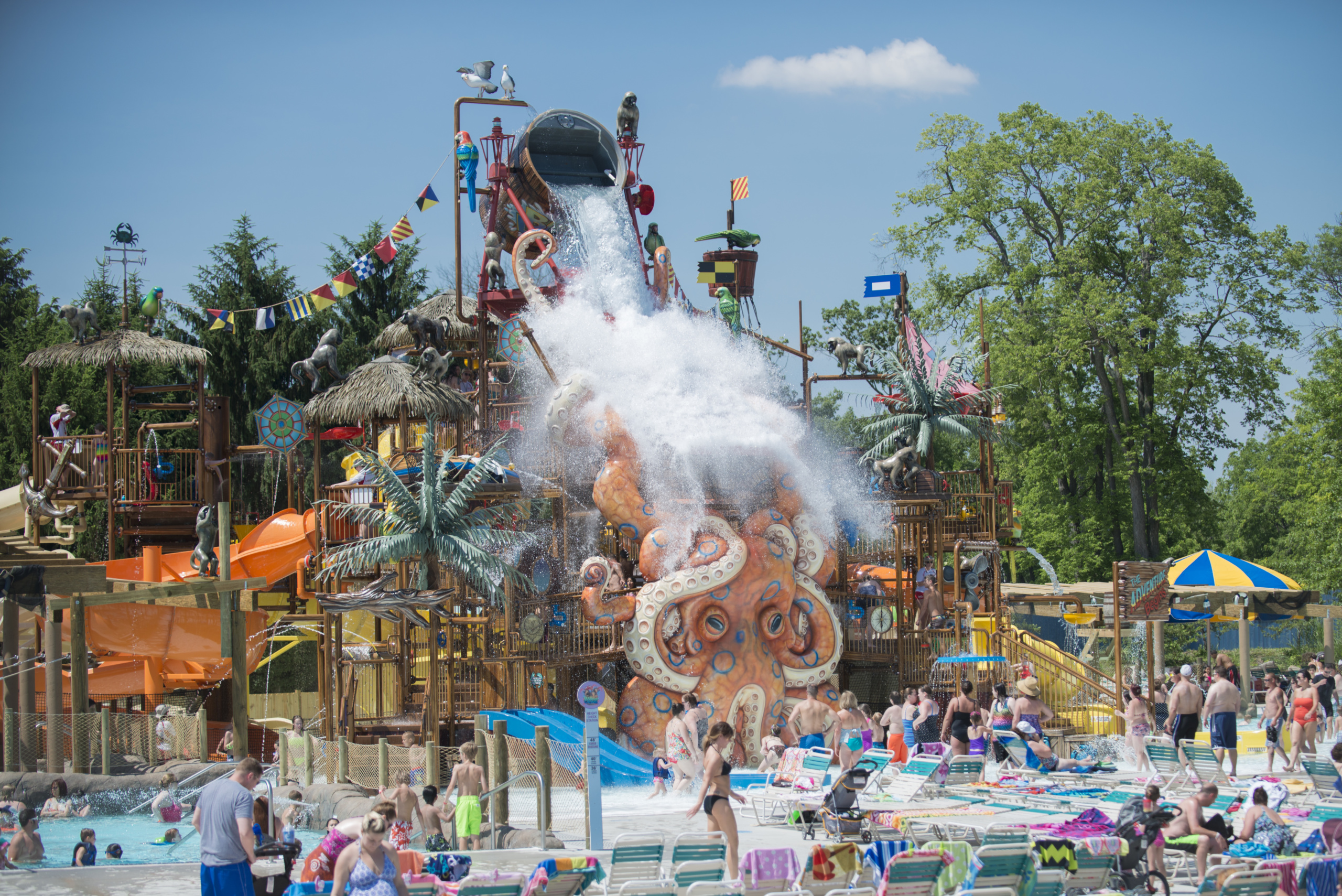 Aquatic play structure with tipping bucket and themed with octopus