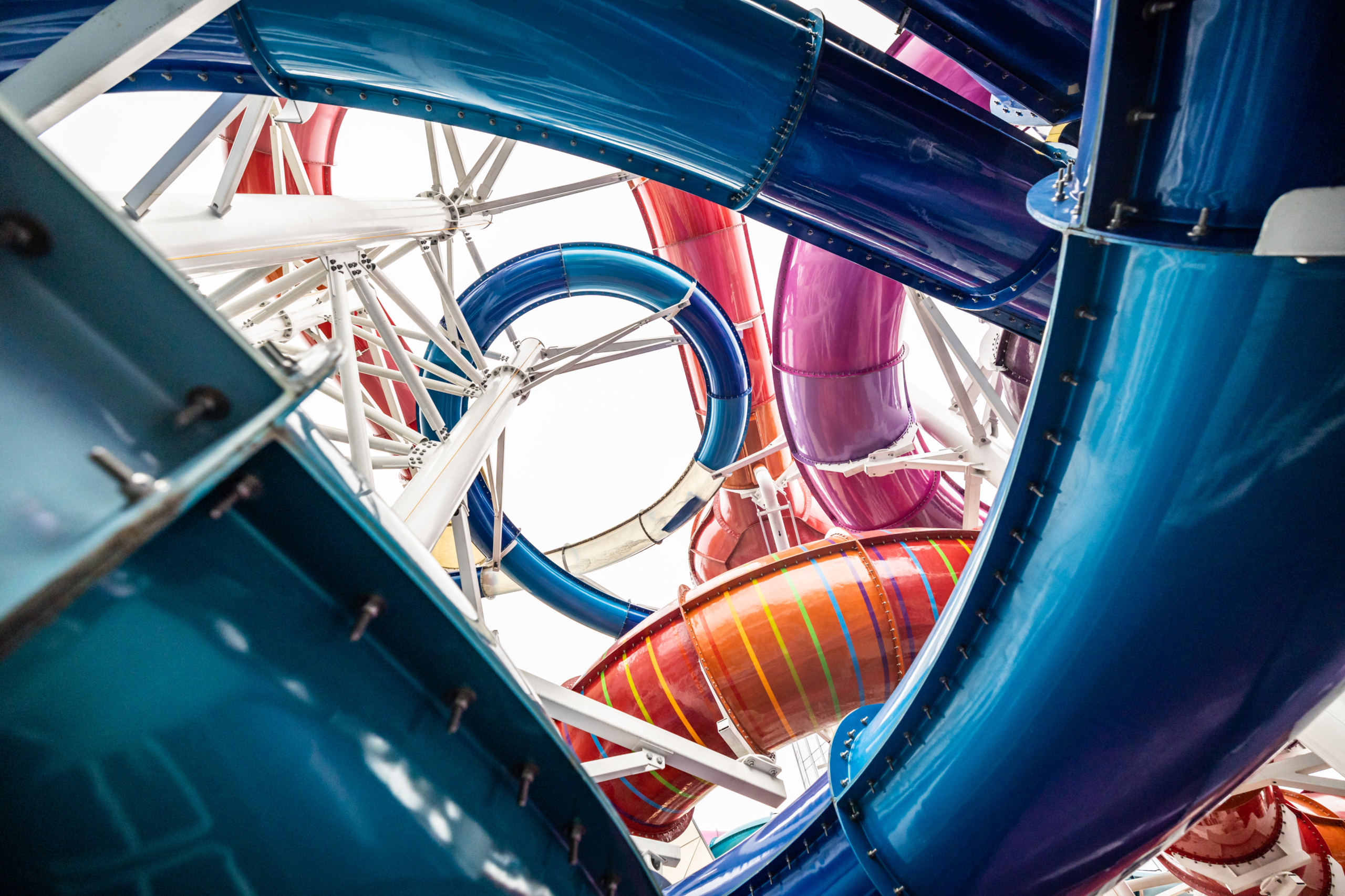 Metallic water slides outside the water park building