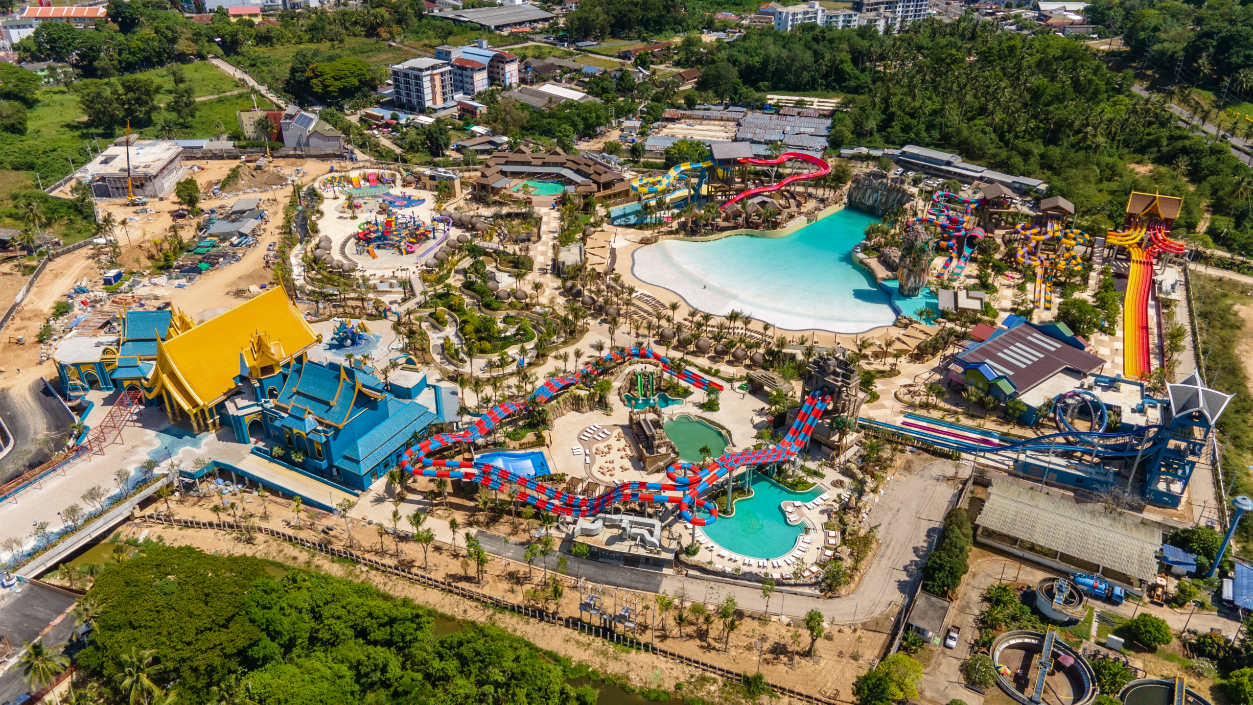 Bird's eye view of water park with water slides and wave pool