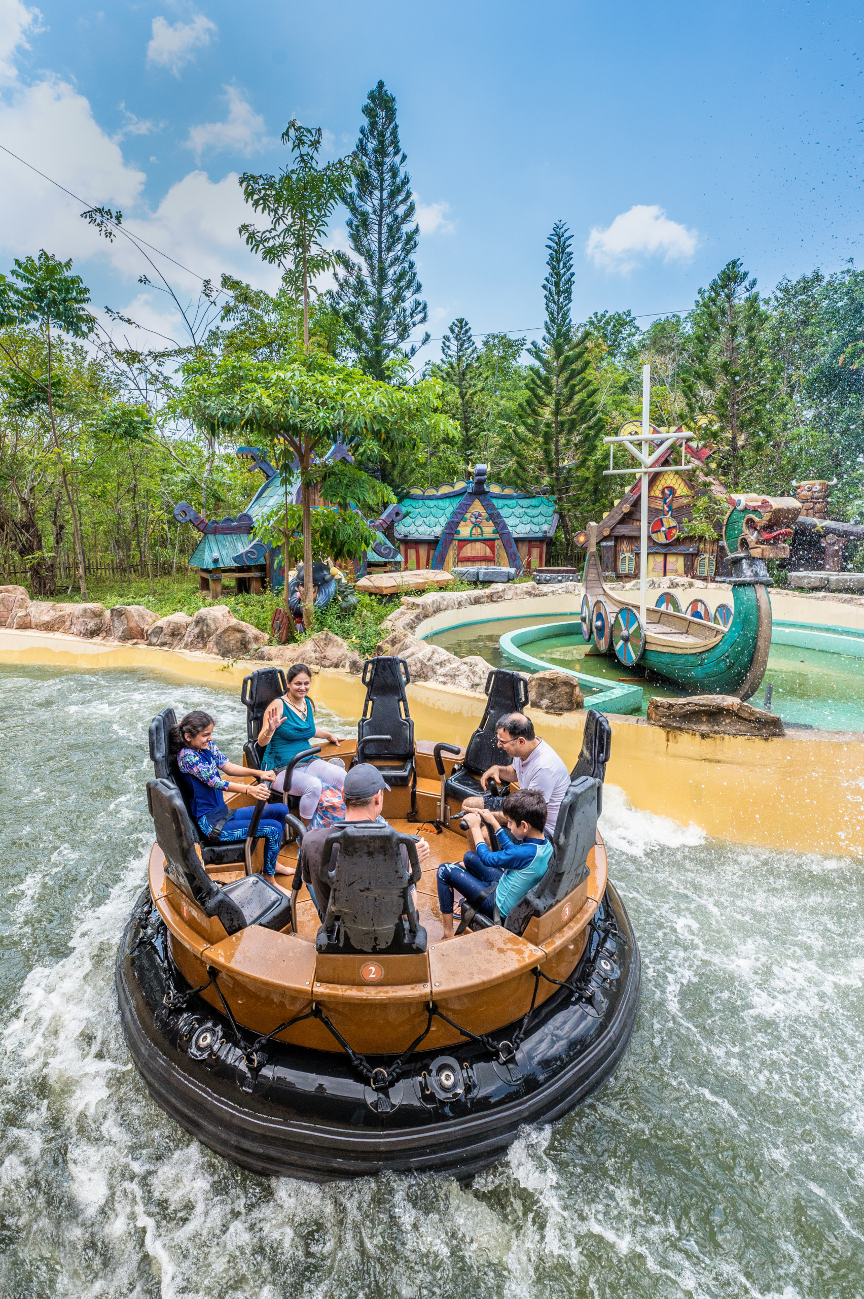 People on a round raft enjoying a water ride