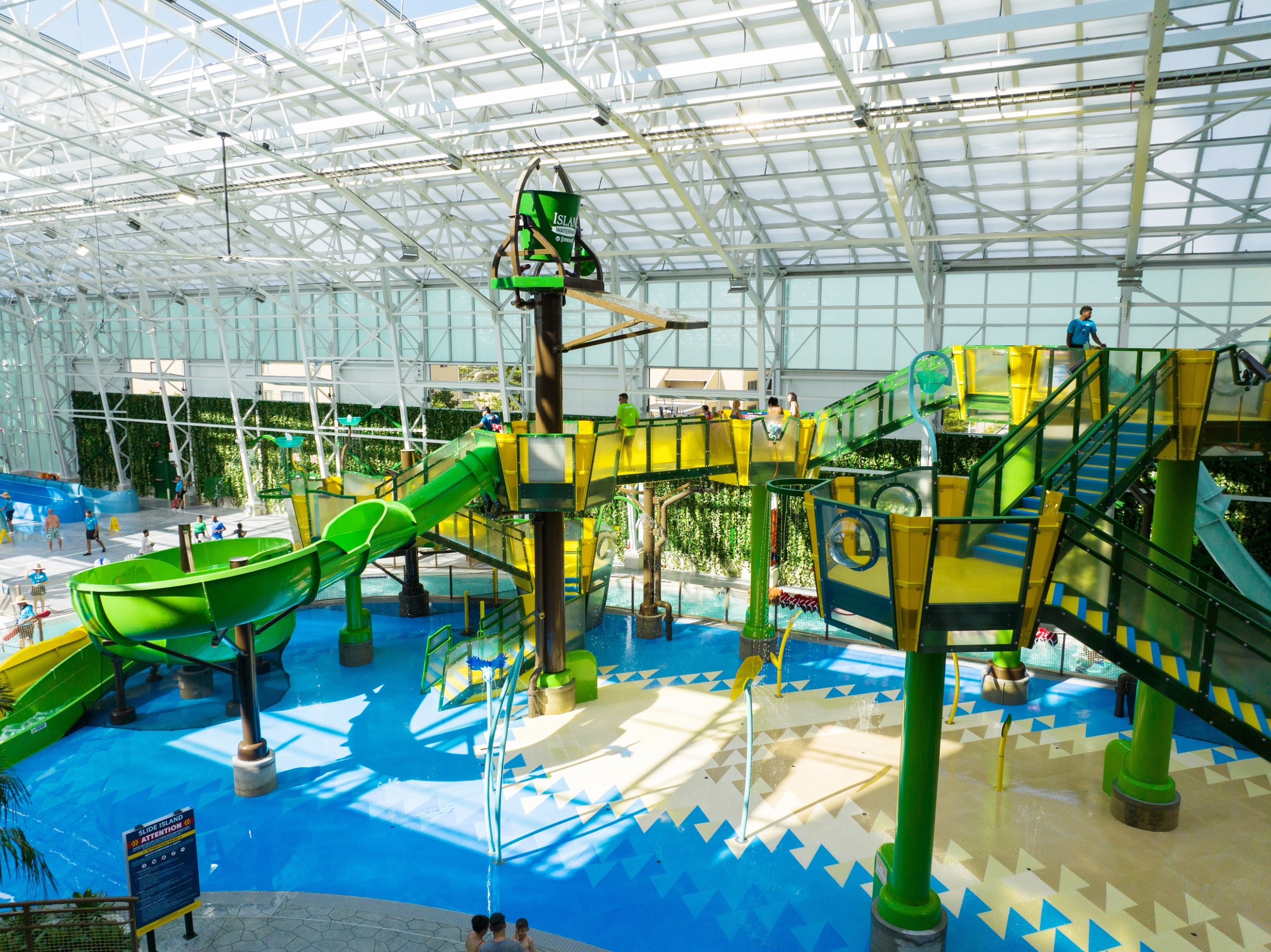 Elevated aquatic play structure in yellow and green