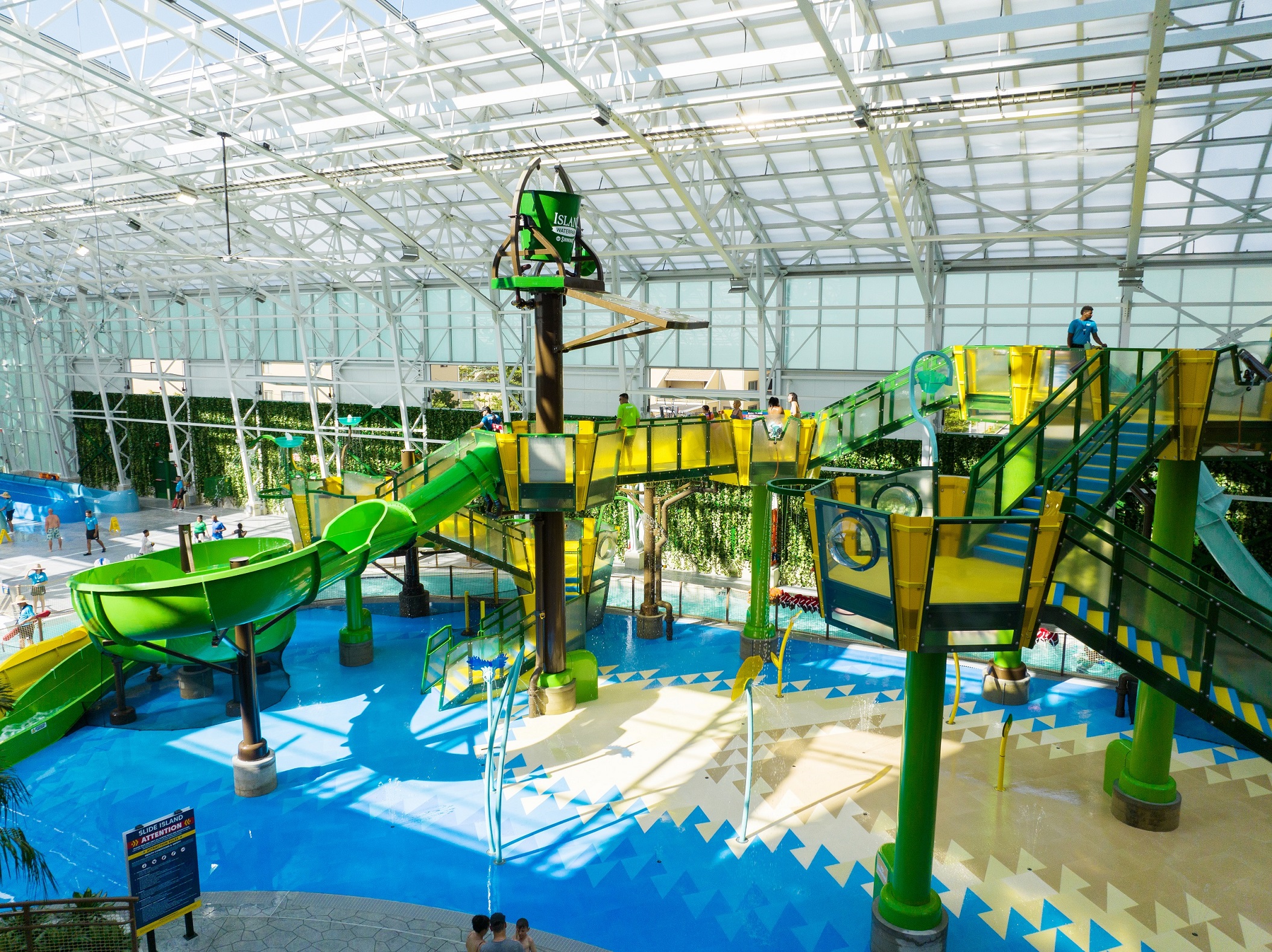 A multi-level aquatic play structure at an indoor water park