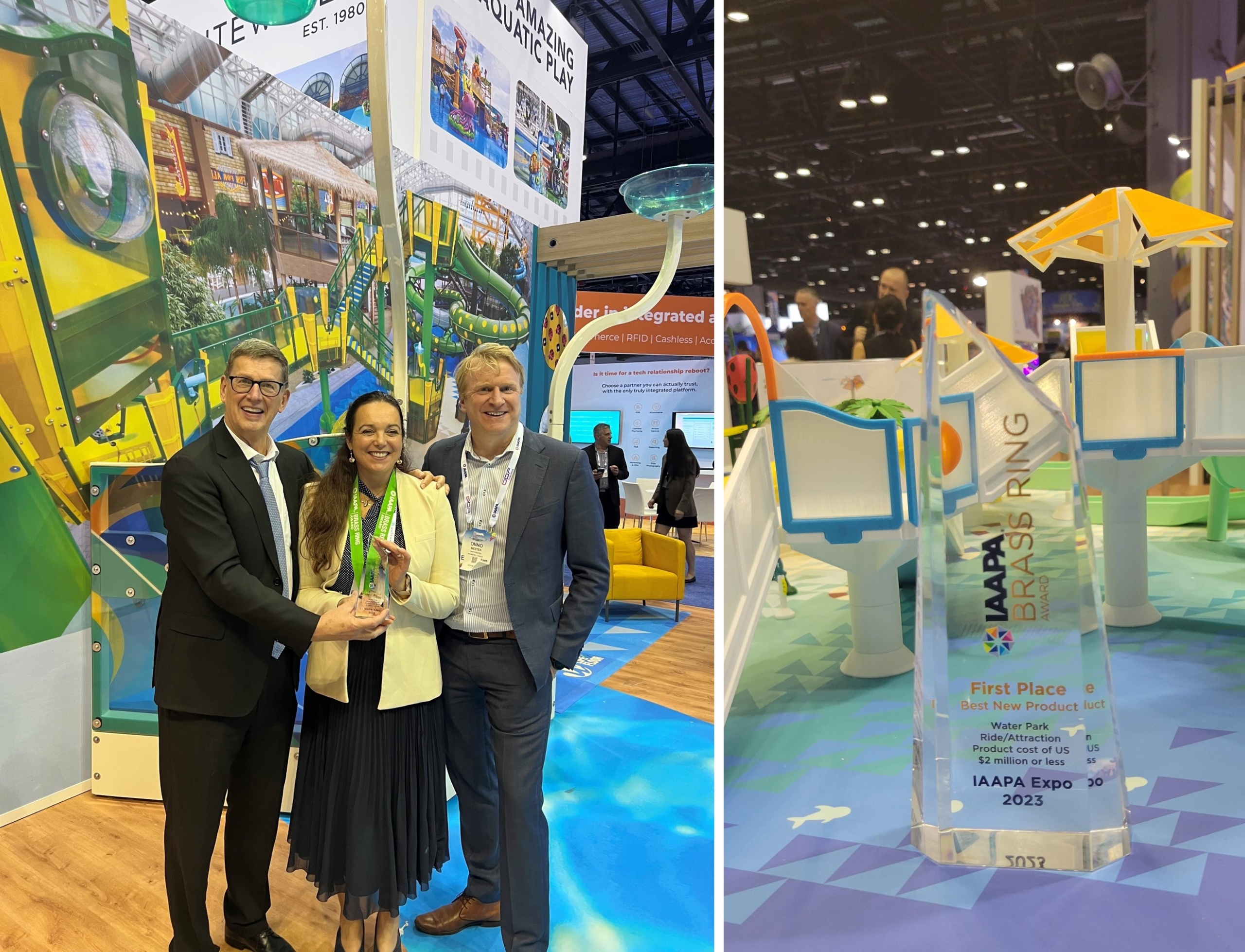 Three people holding Brass Ring Award trophy at IAAPA trade show