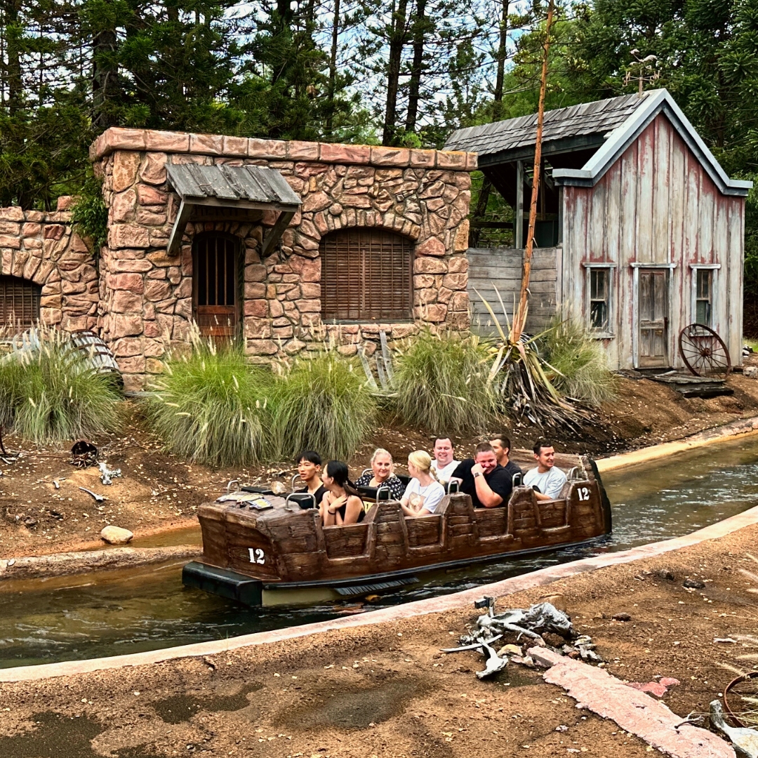 People in a water ride vehicle in a river