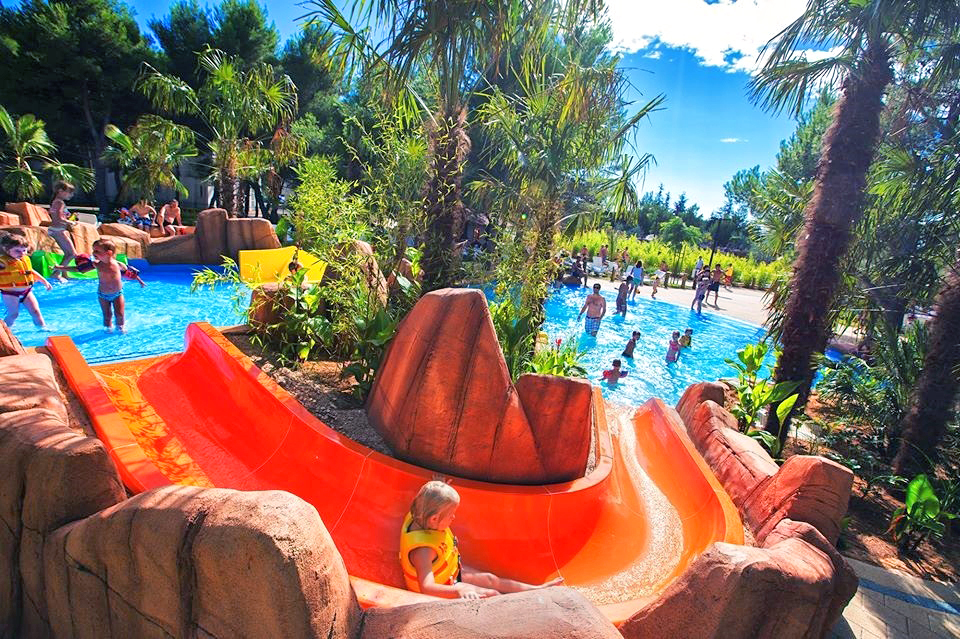 Kid in a water slide at a resort