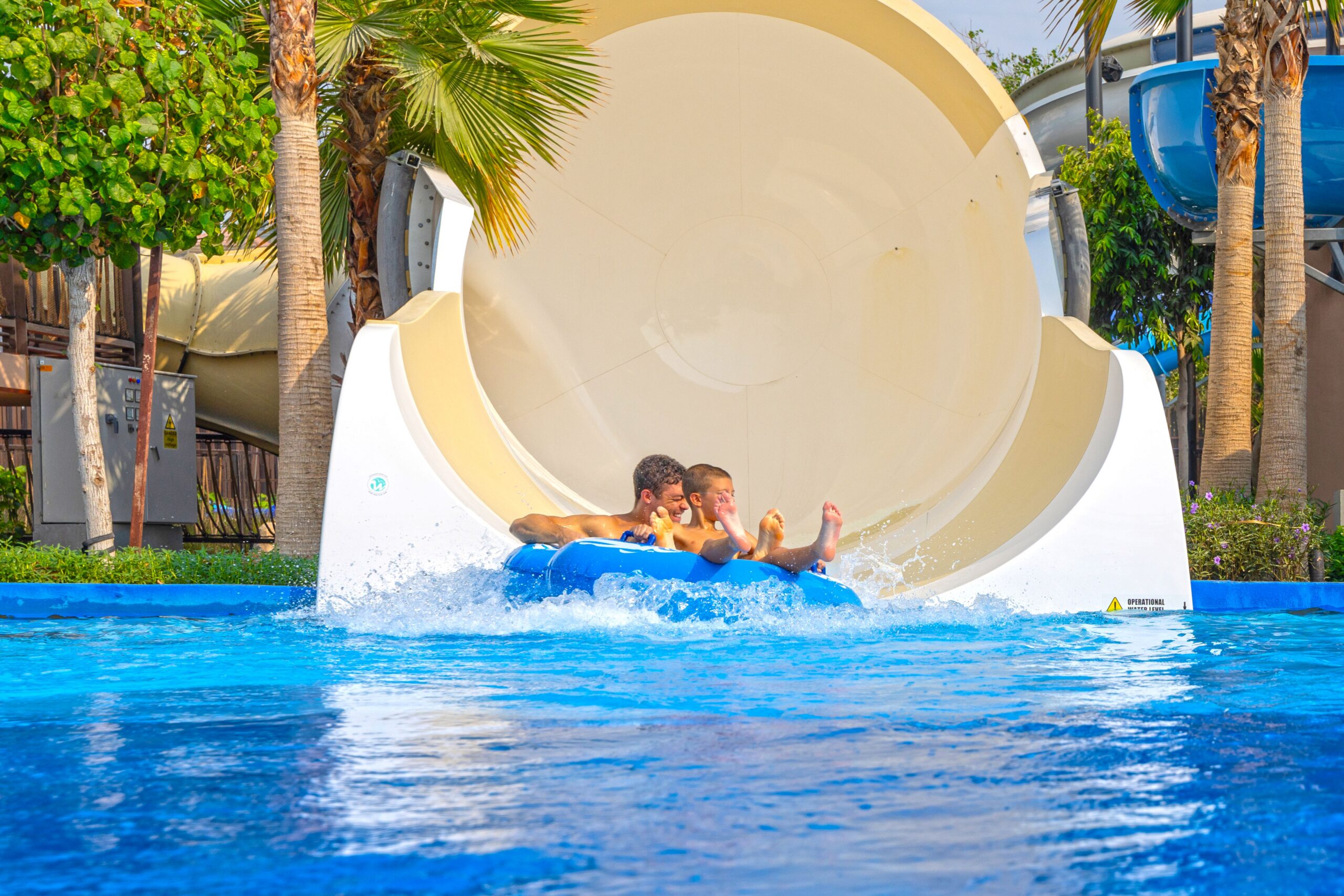 Father and child in an inner tube ride