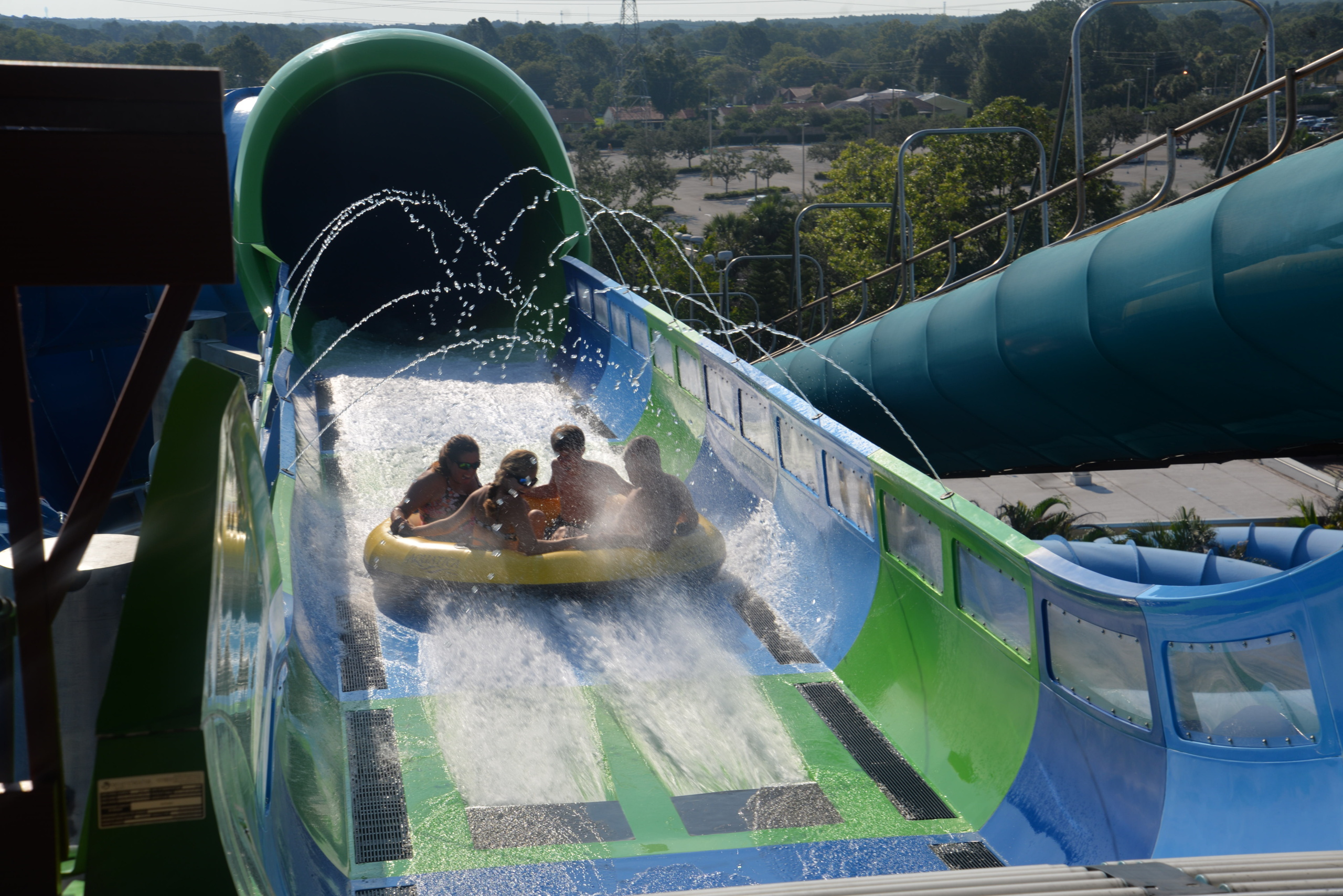 People on a water slide raft