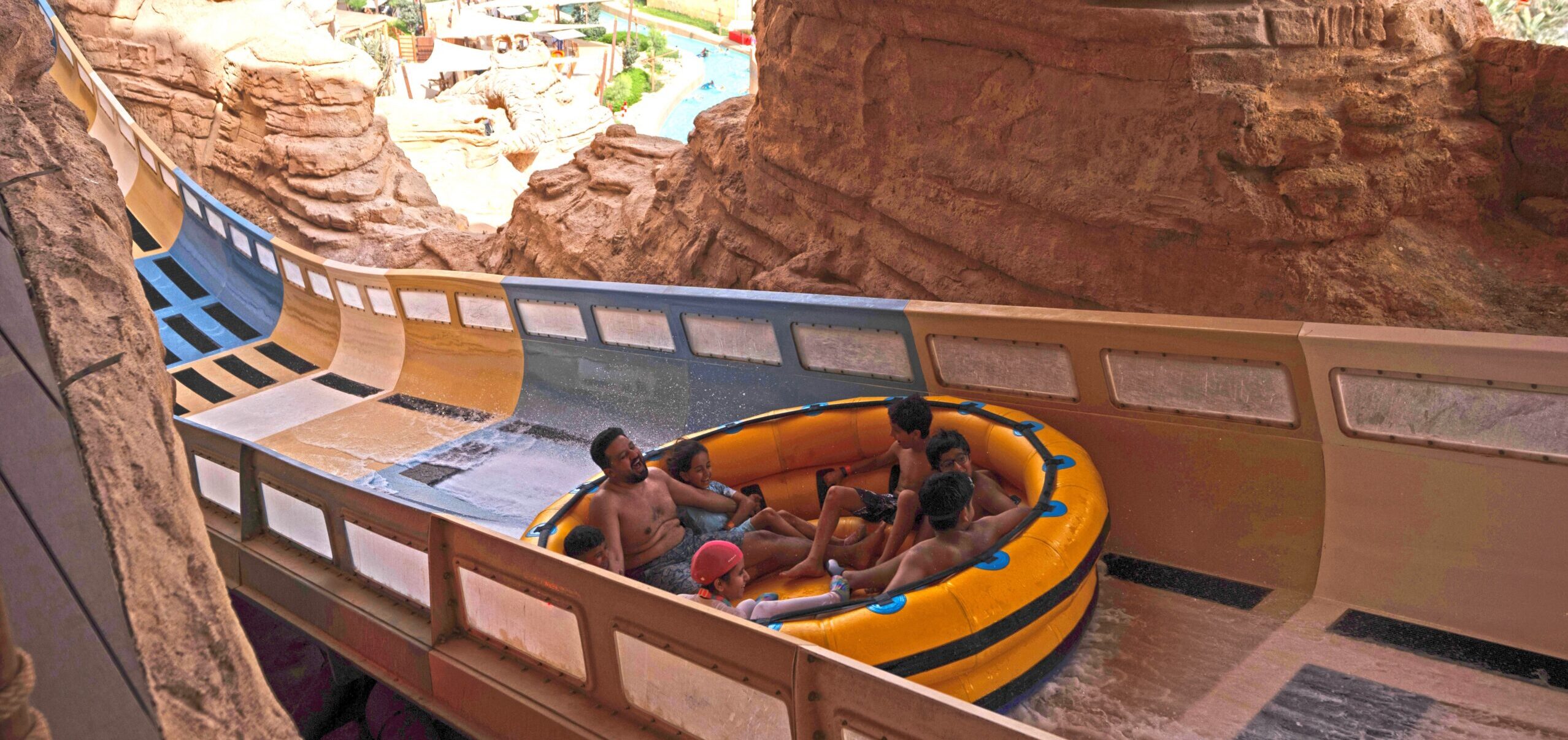 A family of seven in a water coaster raft