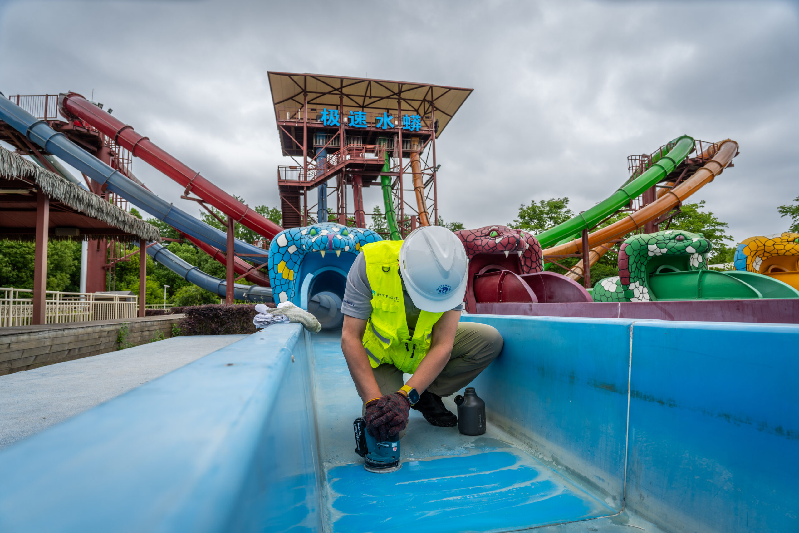 A man polishing a water slide
