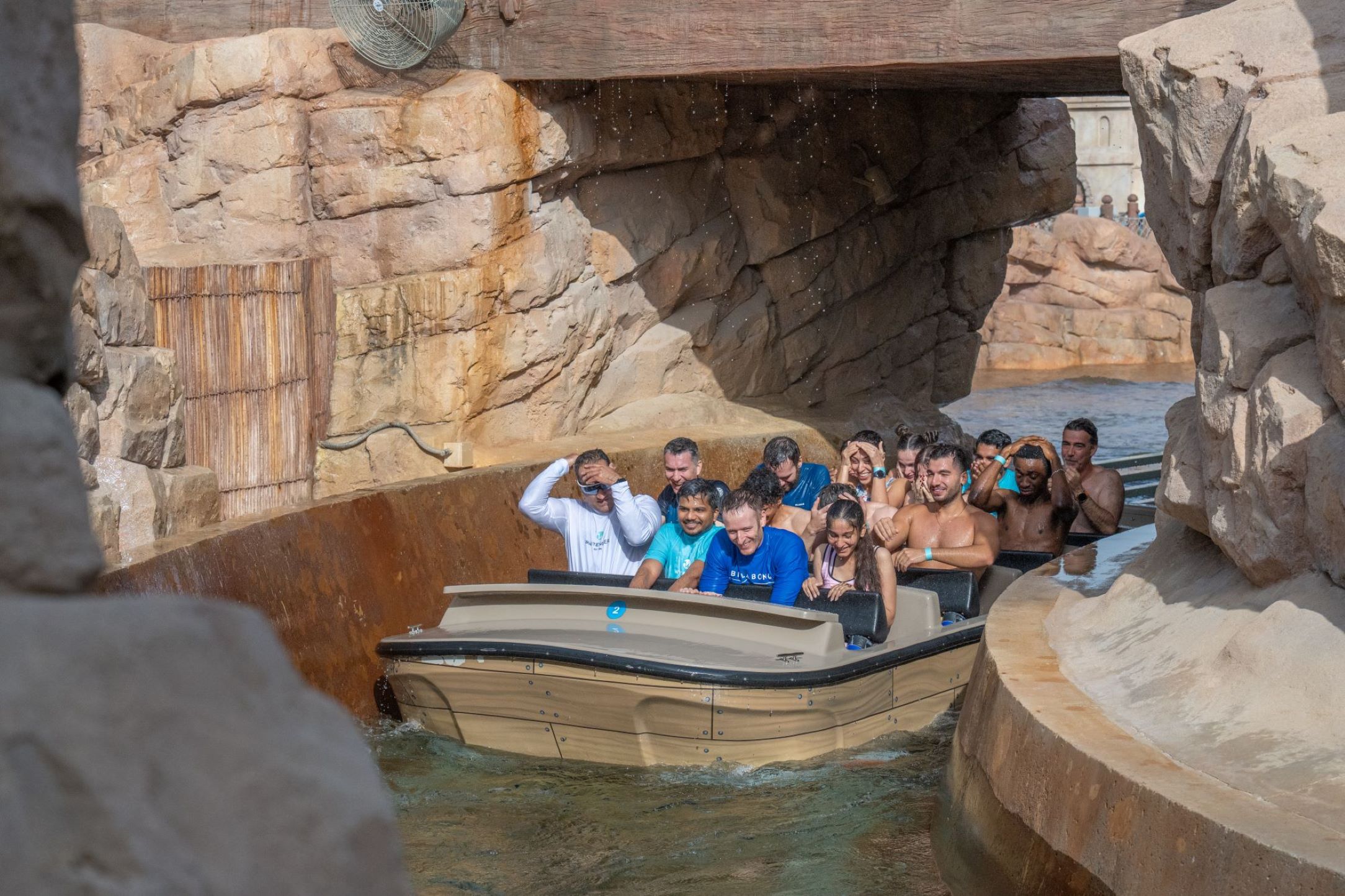 Riders in a 20-seat Shoot the Chute vehicle