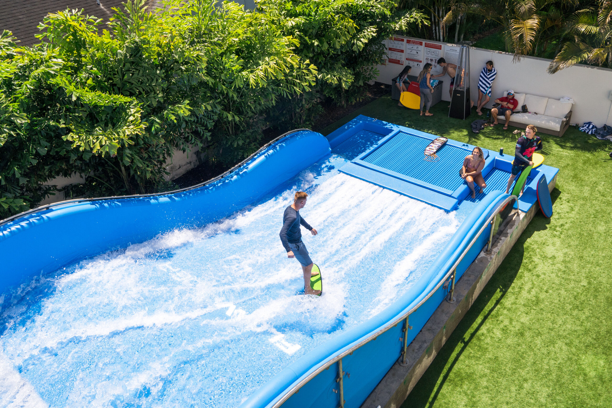 FlowRider surfing in his backyard on his FlowRider Edge