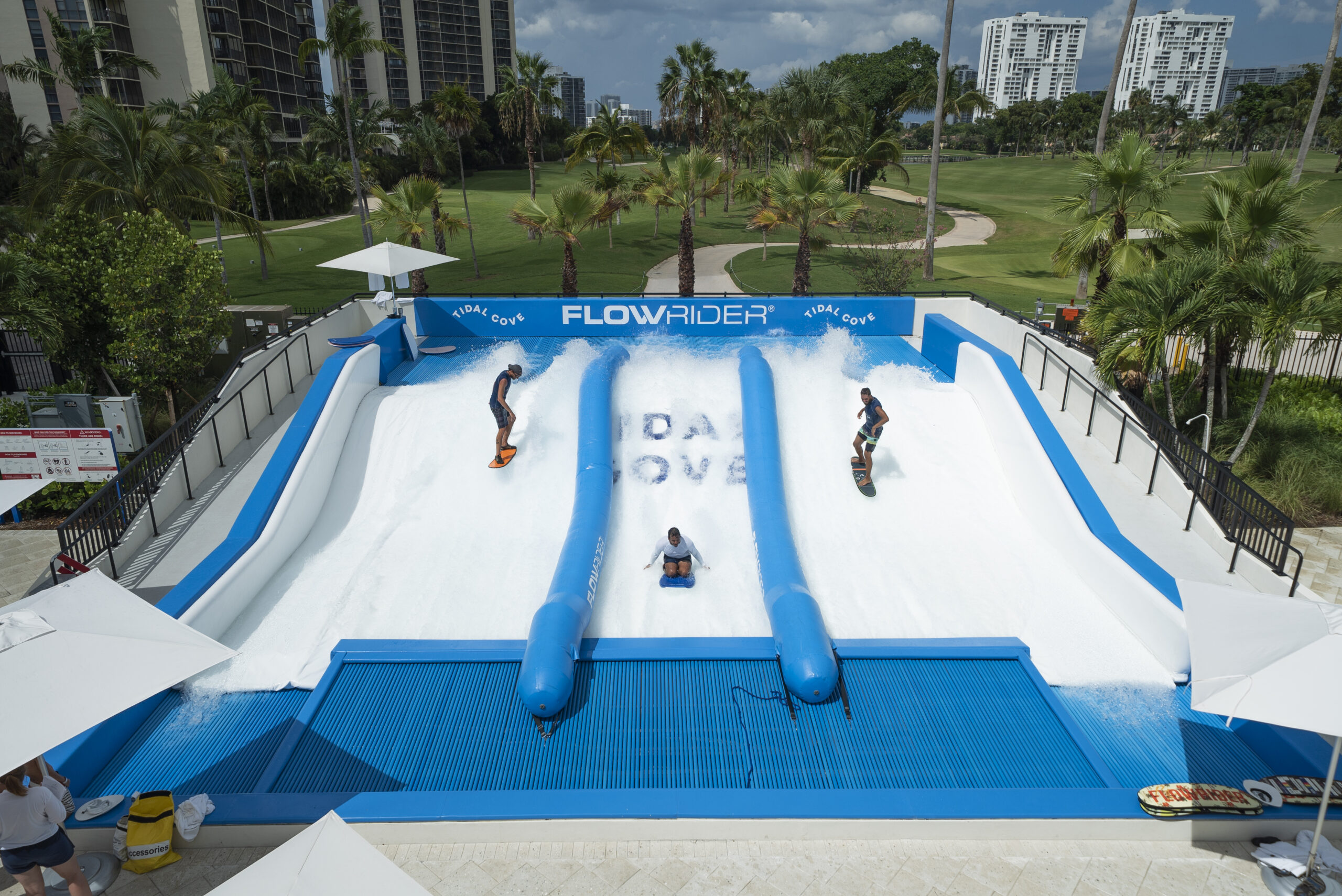3 surfers on a FlowRider Triple