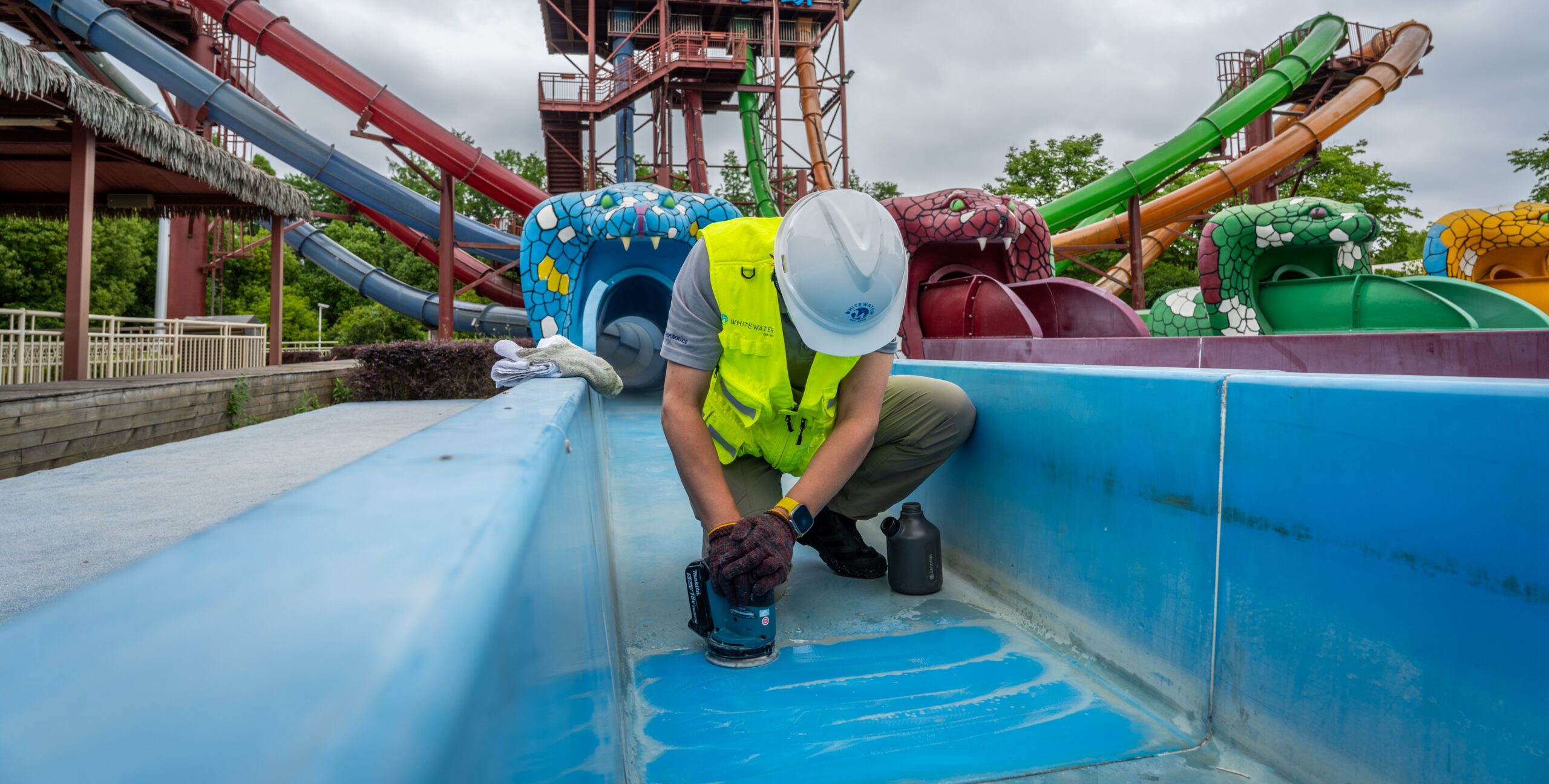 A man polishing a water slide