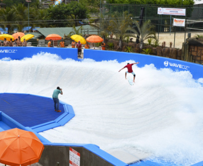 Surfer on the huge surfing surface of a WaveOz