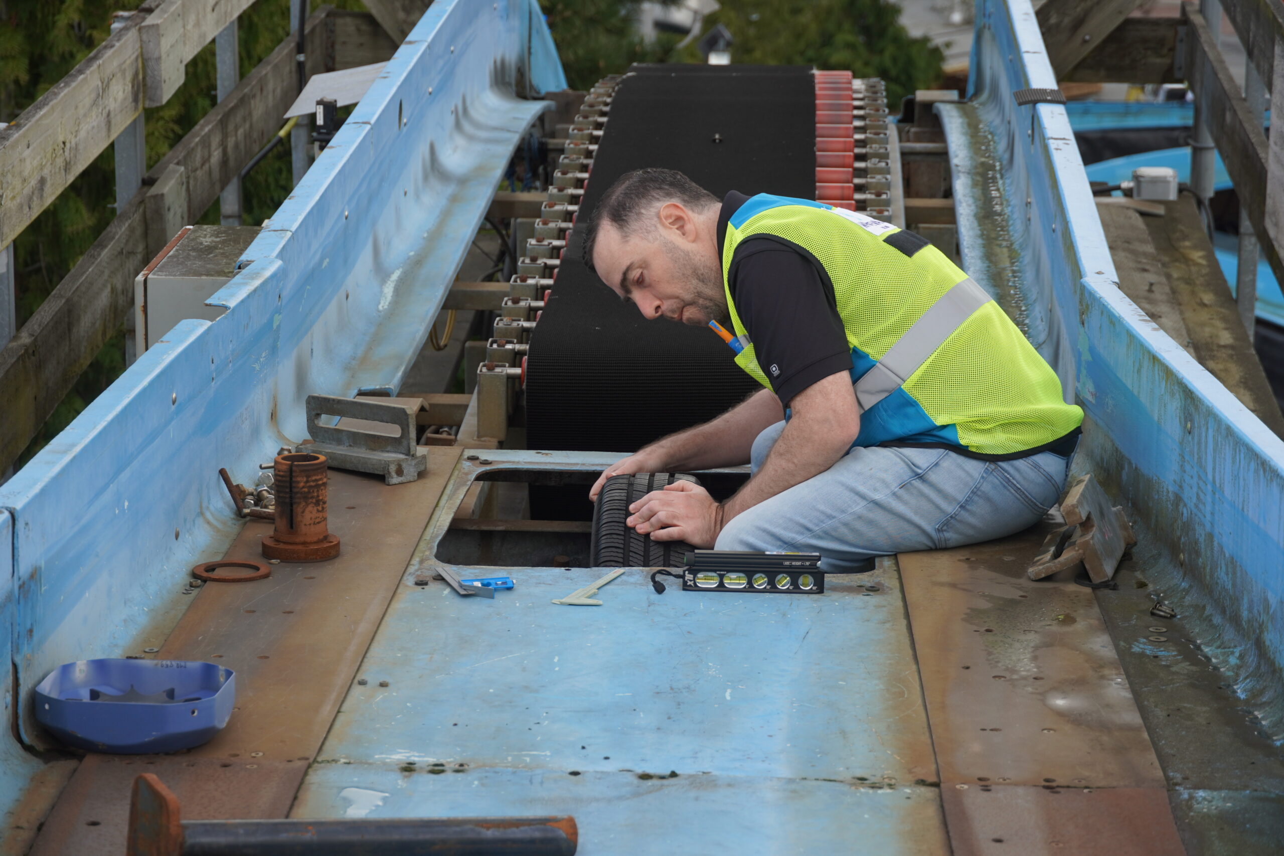 A man performing water ride maintenance