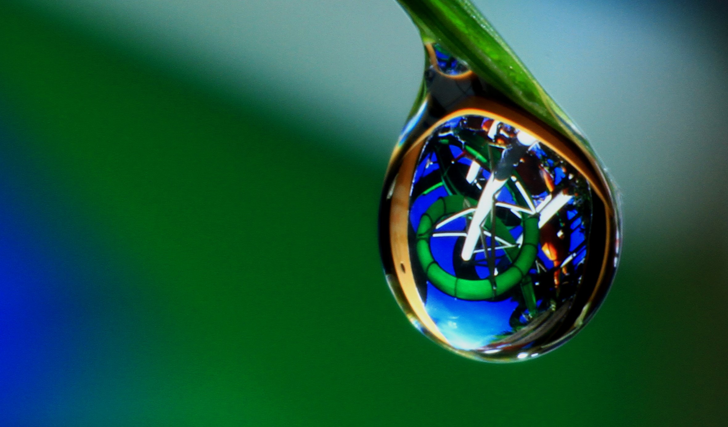 water slide reflection in water droplet