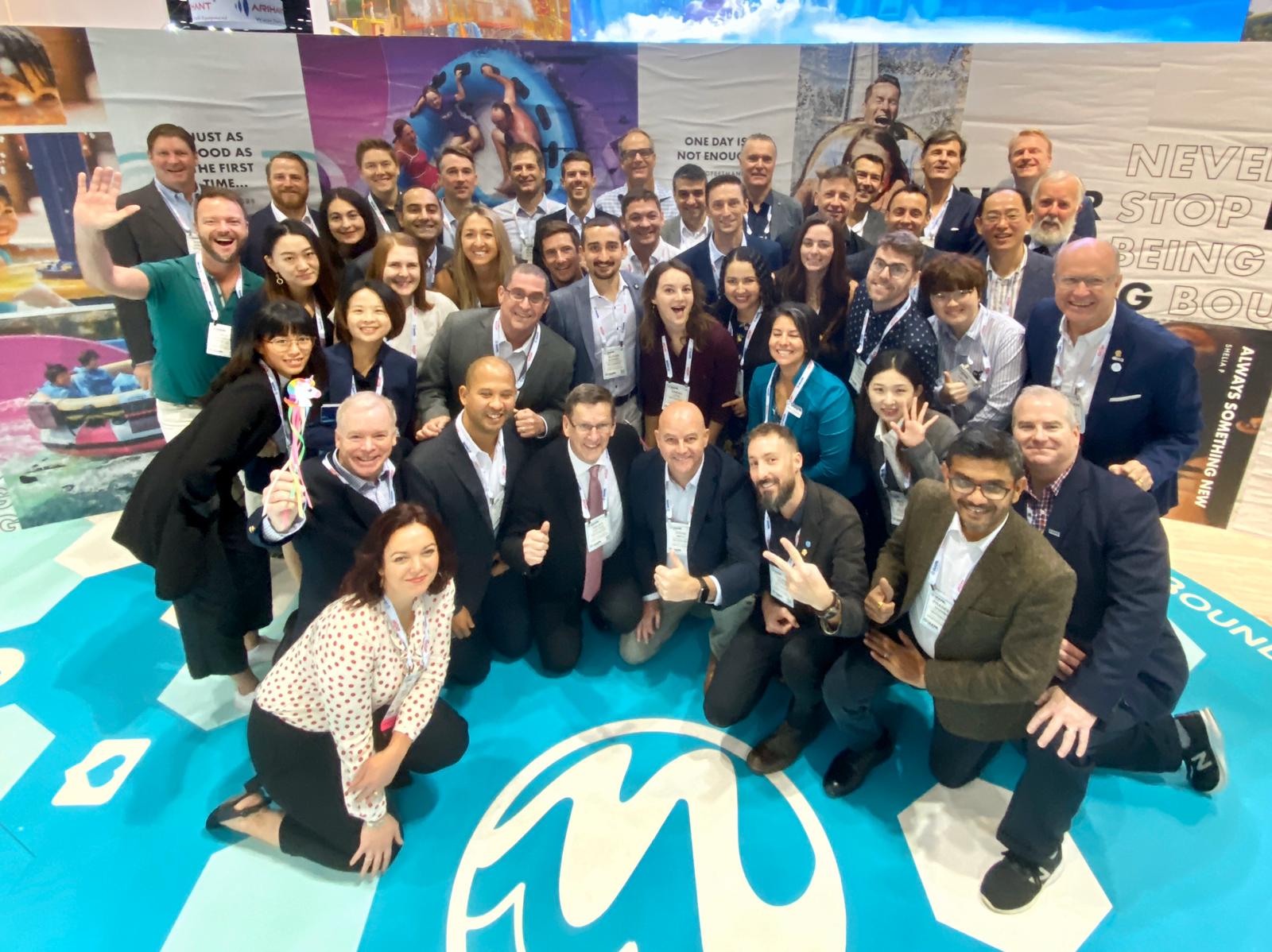 WhiteWater team posing at trade show