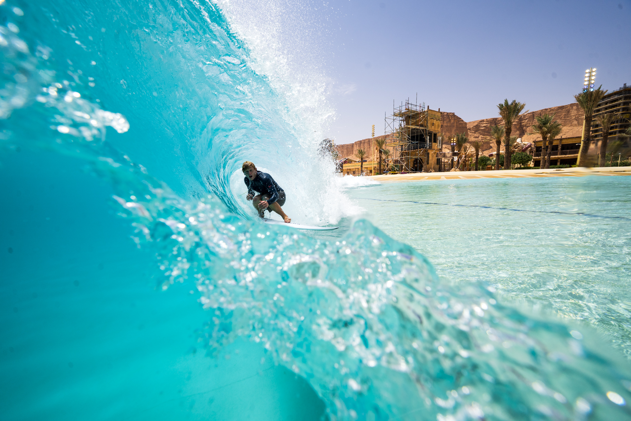 surfer in a surf pool in the desert