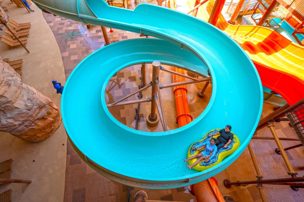 A two-person inner tube on a water slide