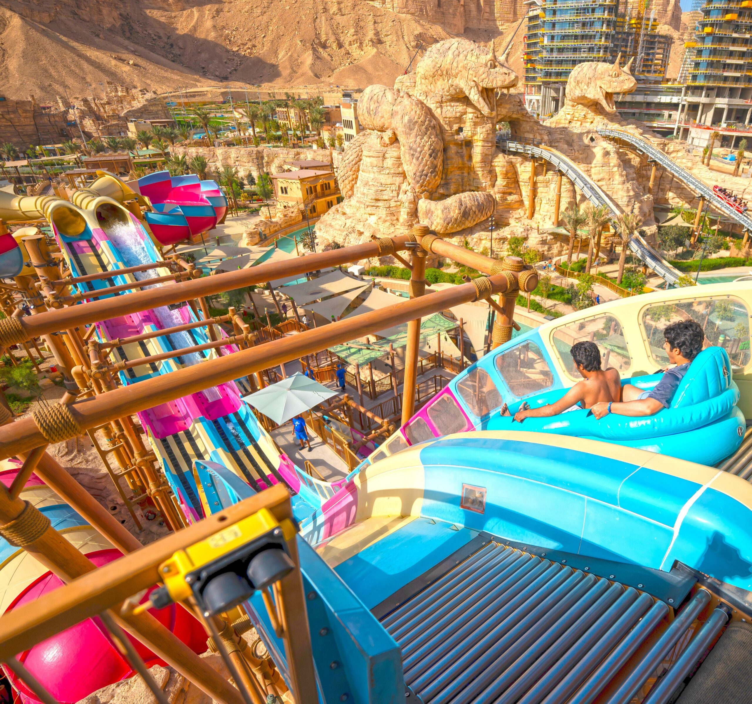 Two riders on an inner tube water slide
