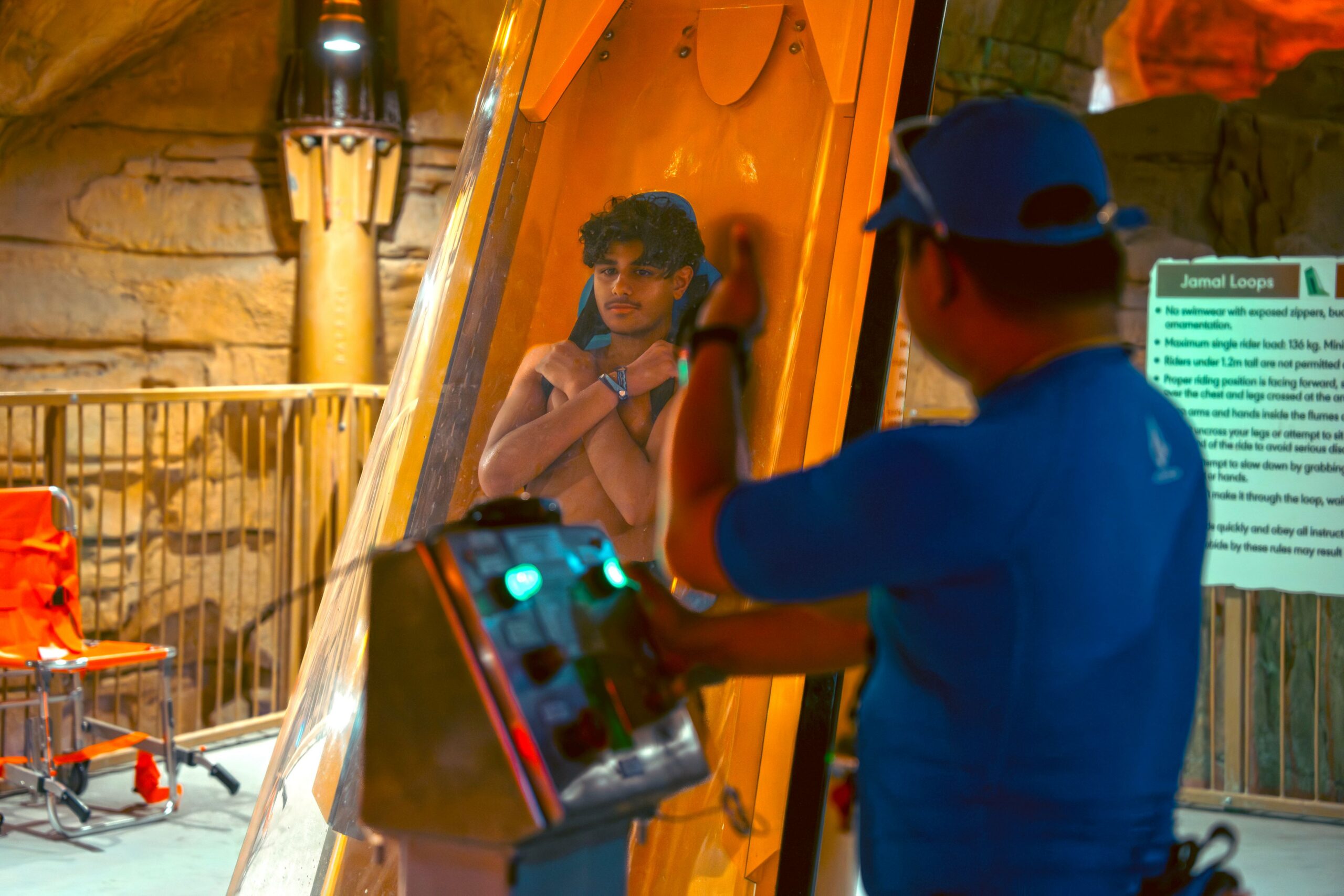 A rider inside an AquaLaunch capsule with operator giving the thumbs up